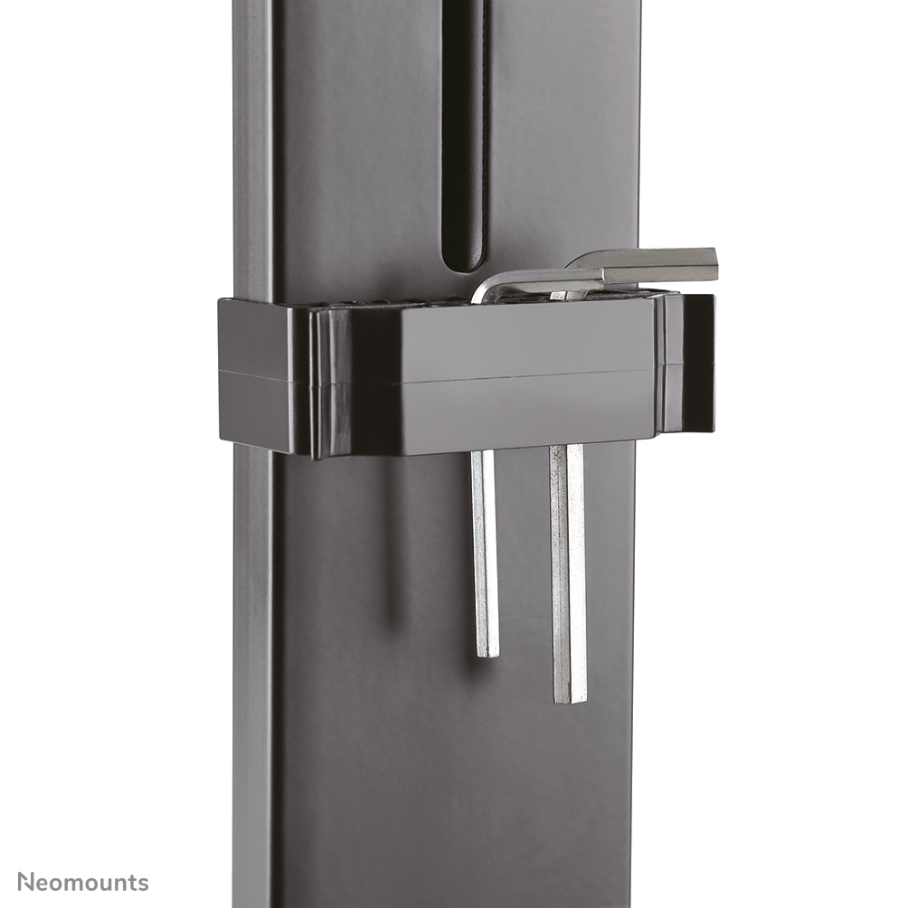 Close-up of a black metal bracket with a silver Allen wrench inside. Two silver metal bars hang down. White background.