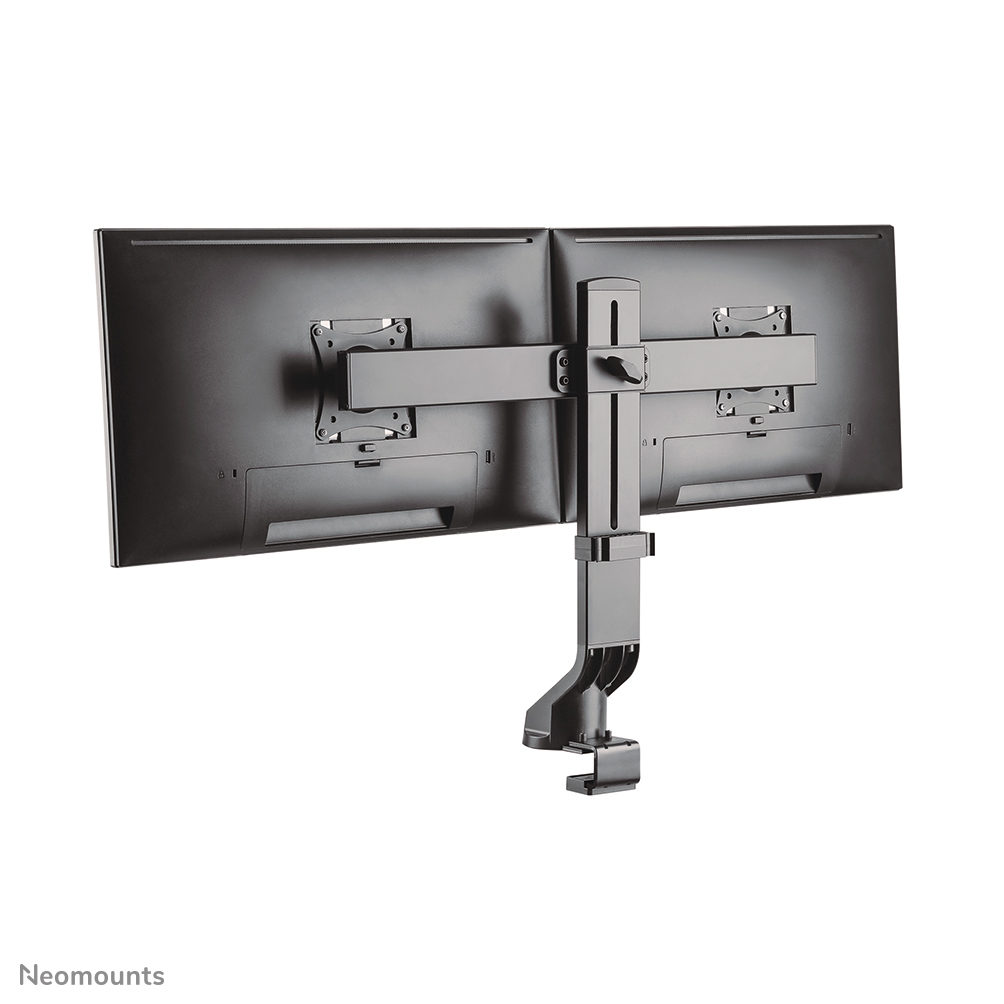 Two black computer monitors attached to a silver monitor arm. The arm is clamped to a surface.