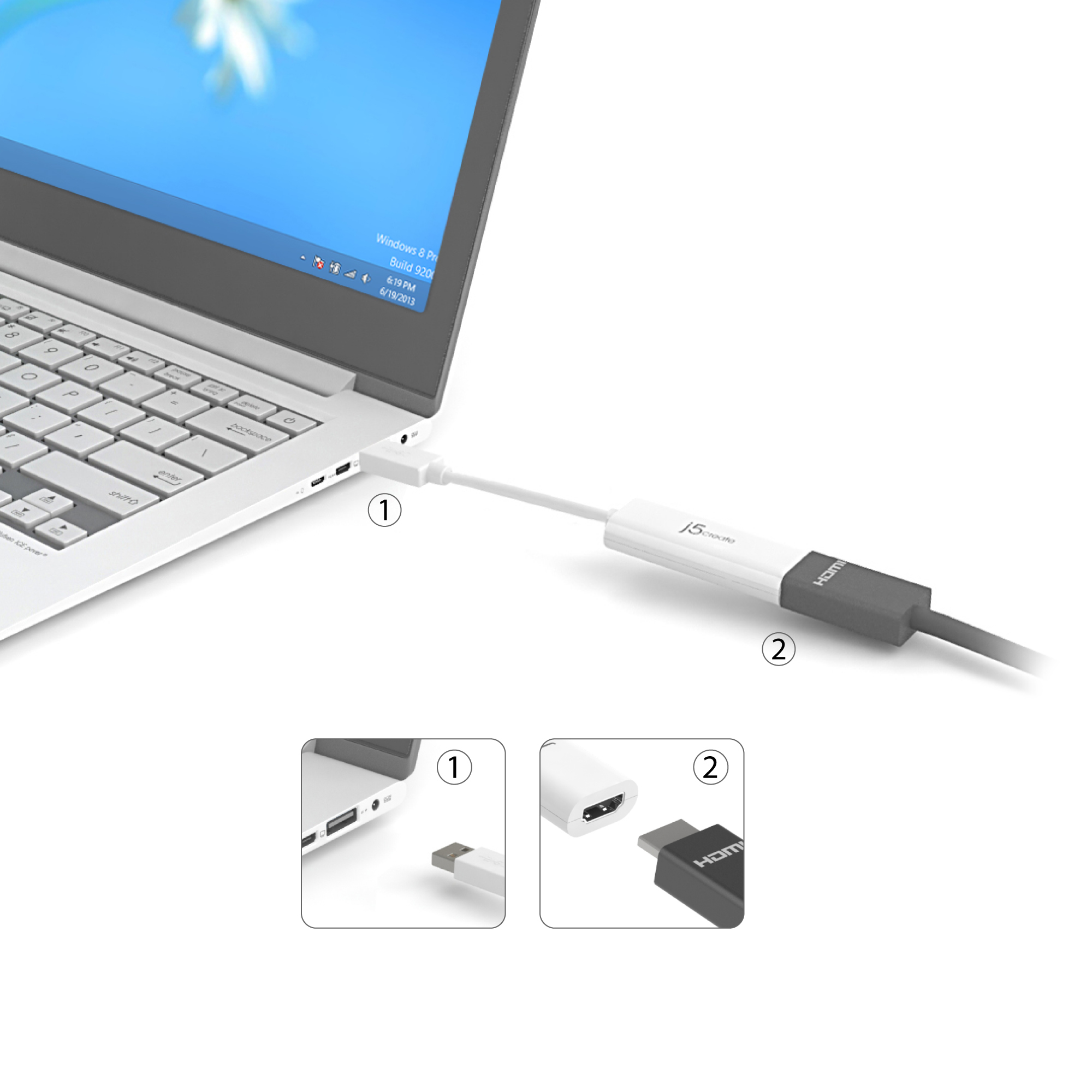 Un portátil conectado a un adaptador HDMI. El adaptador está conectado al portátil en un extremo y tiene un conector HDMI en el otro.