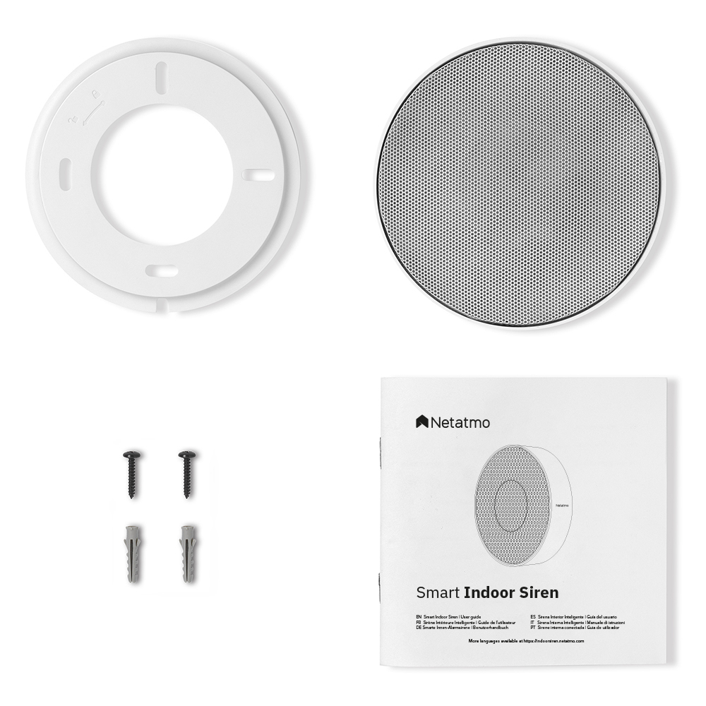 Una sirena bianca, un altoparlante con una rete, viti e un manuale etichettato 'Smart Indoor Siren' di Netatmo.