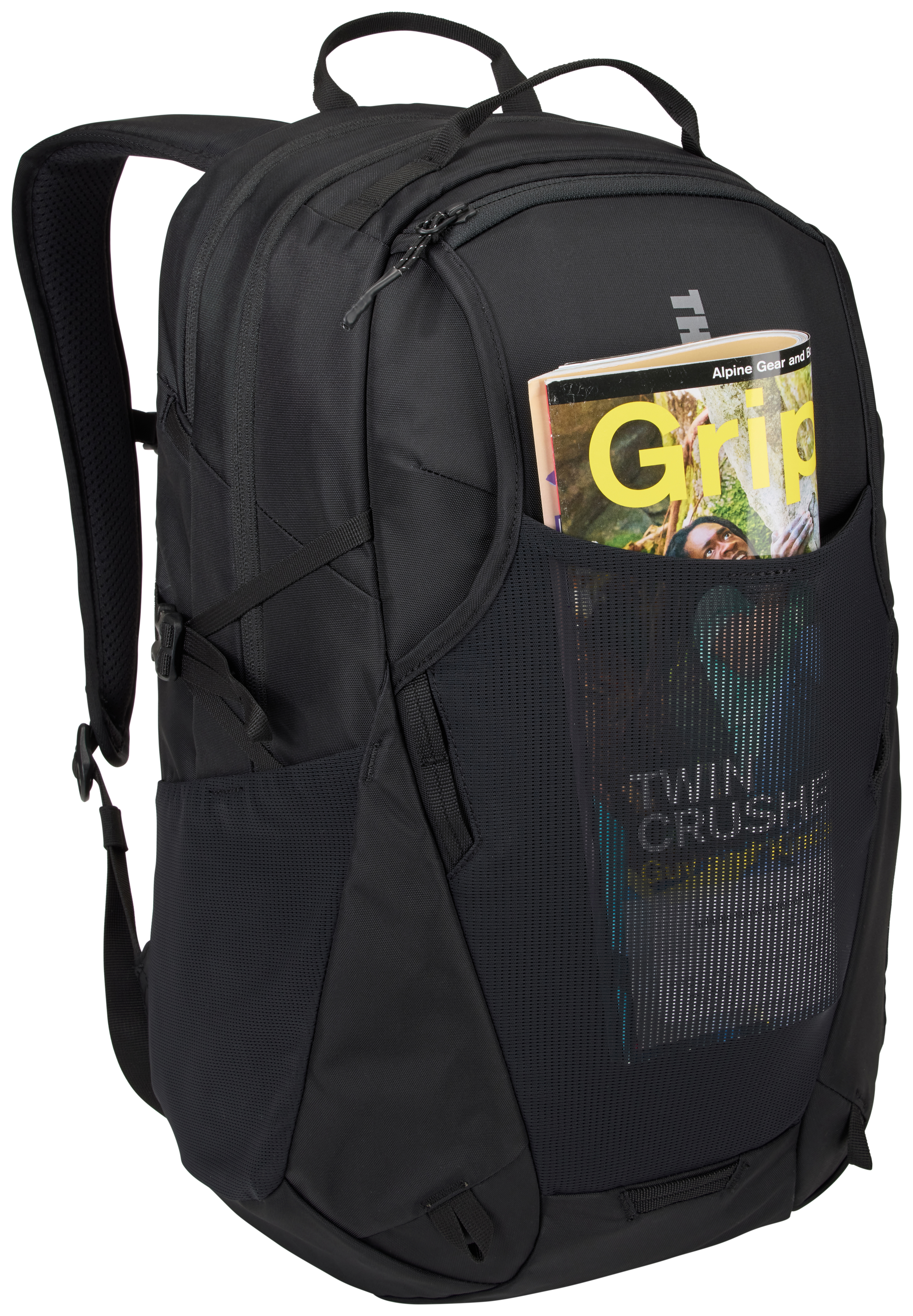 Schwarzer Rucksack mit Zeitschrift in der Seitentasche. Zeitschrift hat gelben 'Grip'-Text.