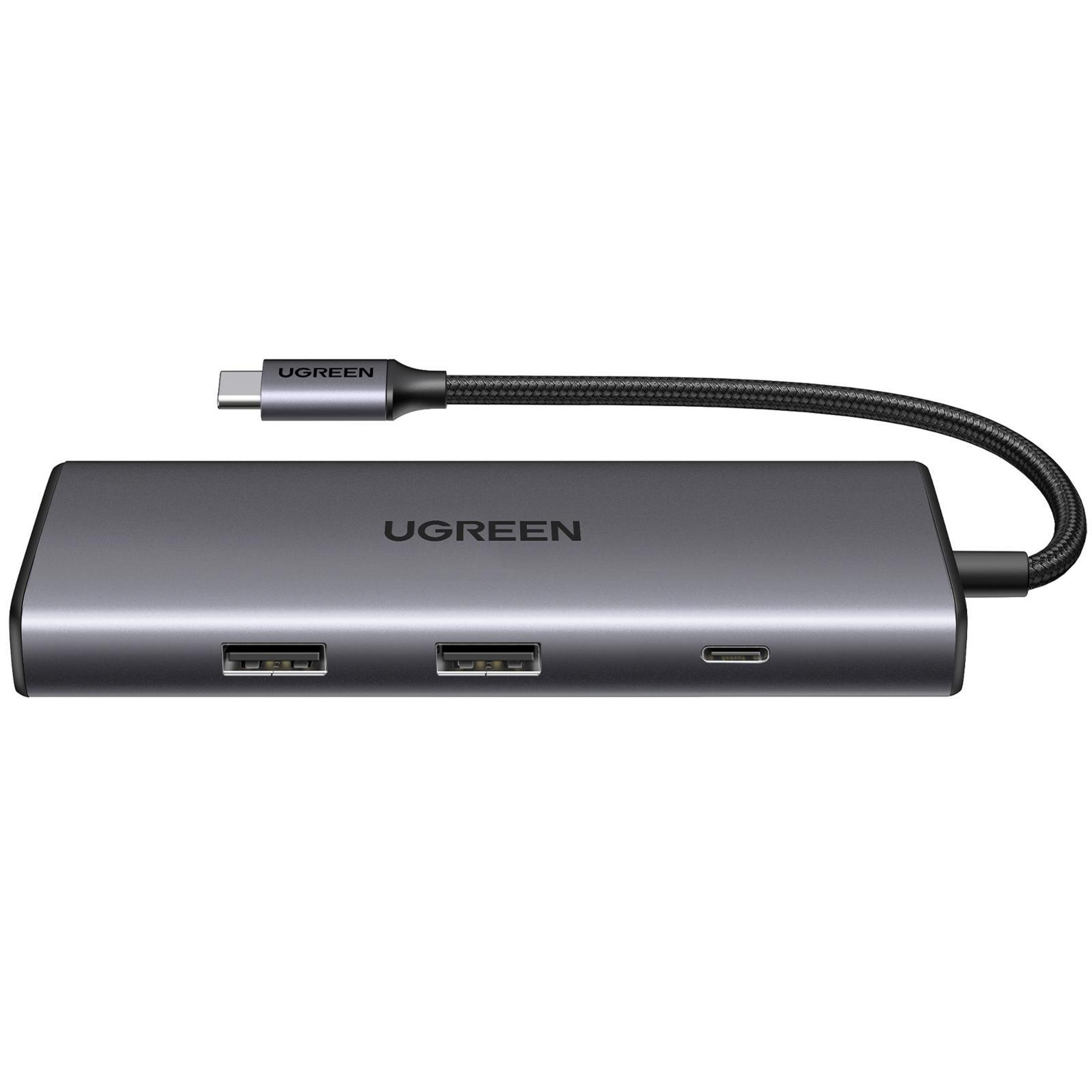 Viene visualizzato un hub USB-C UGREEN. È grigio, con porte e un cavo USB-C collegato.