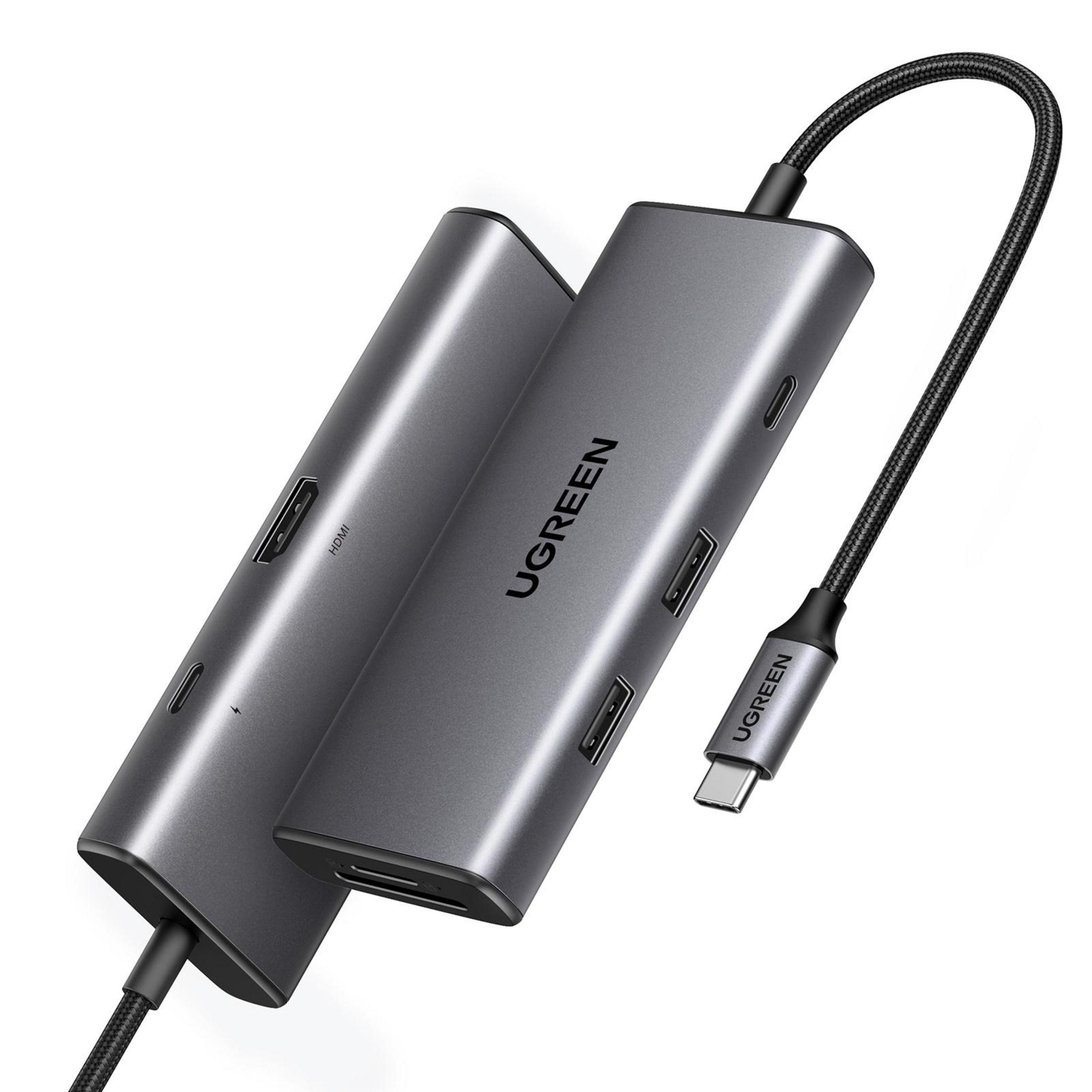 Un hub USB-C UGREEN grigio con più porte e un cavo intrecciato nero. Il dispositivo ha il logo UGREEN.
