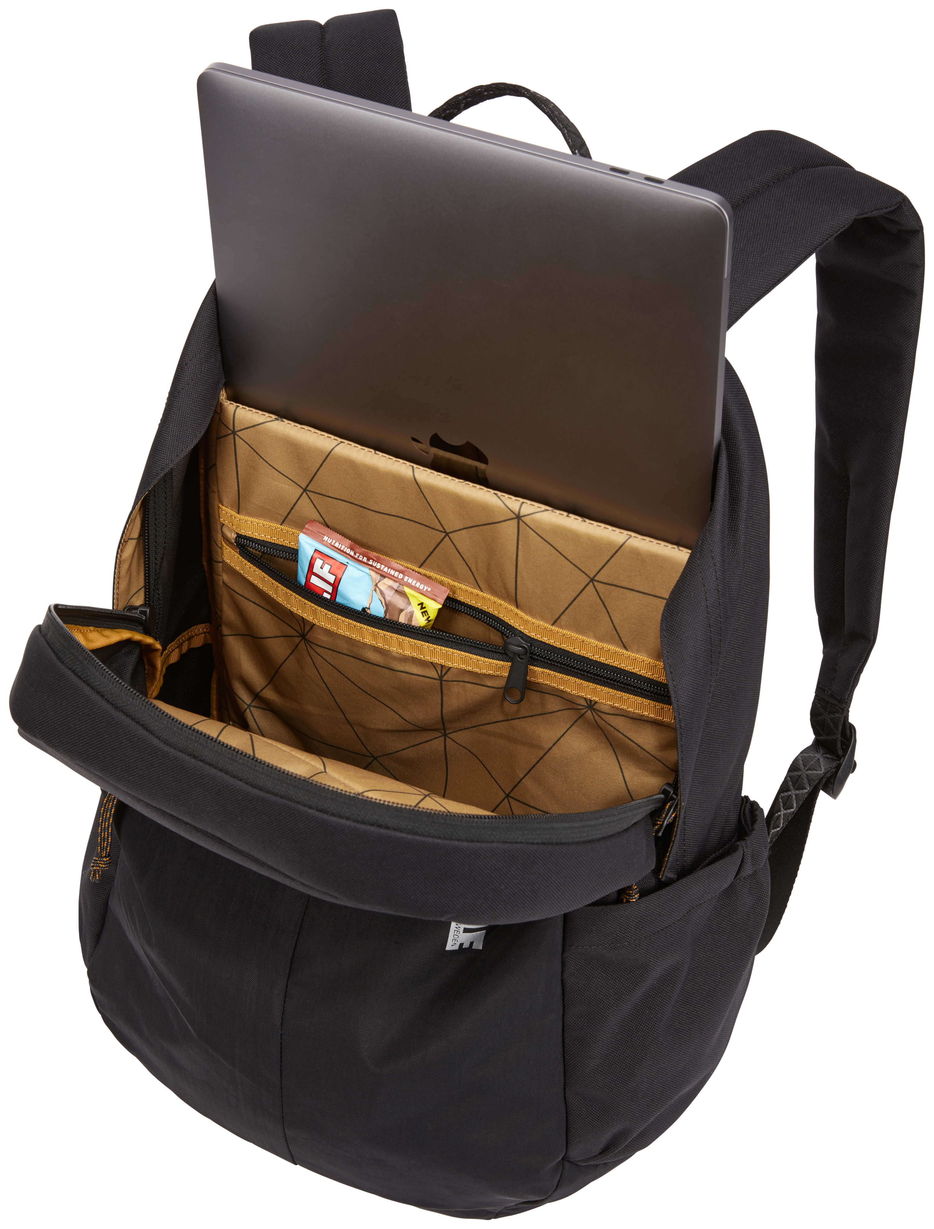 Uno zaino nero con uno scomparto aperto che contiene un laptop e una barretta. L'interno è beige con un motivo geometrico.