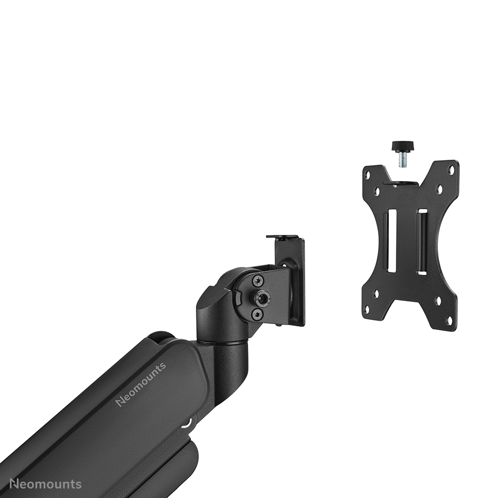A black monitor mount with a bracket and arm, parts separated. The arm has the brand name, Neomounts. White background.