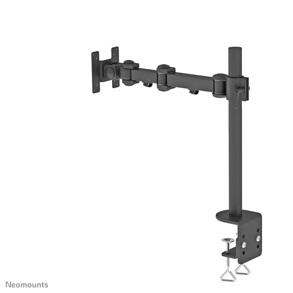 A black monitor arm is mounted on a white surface. It is clamped to the edge of a table, with multiple joints and screws.