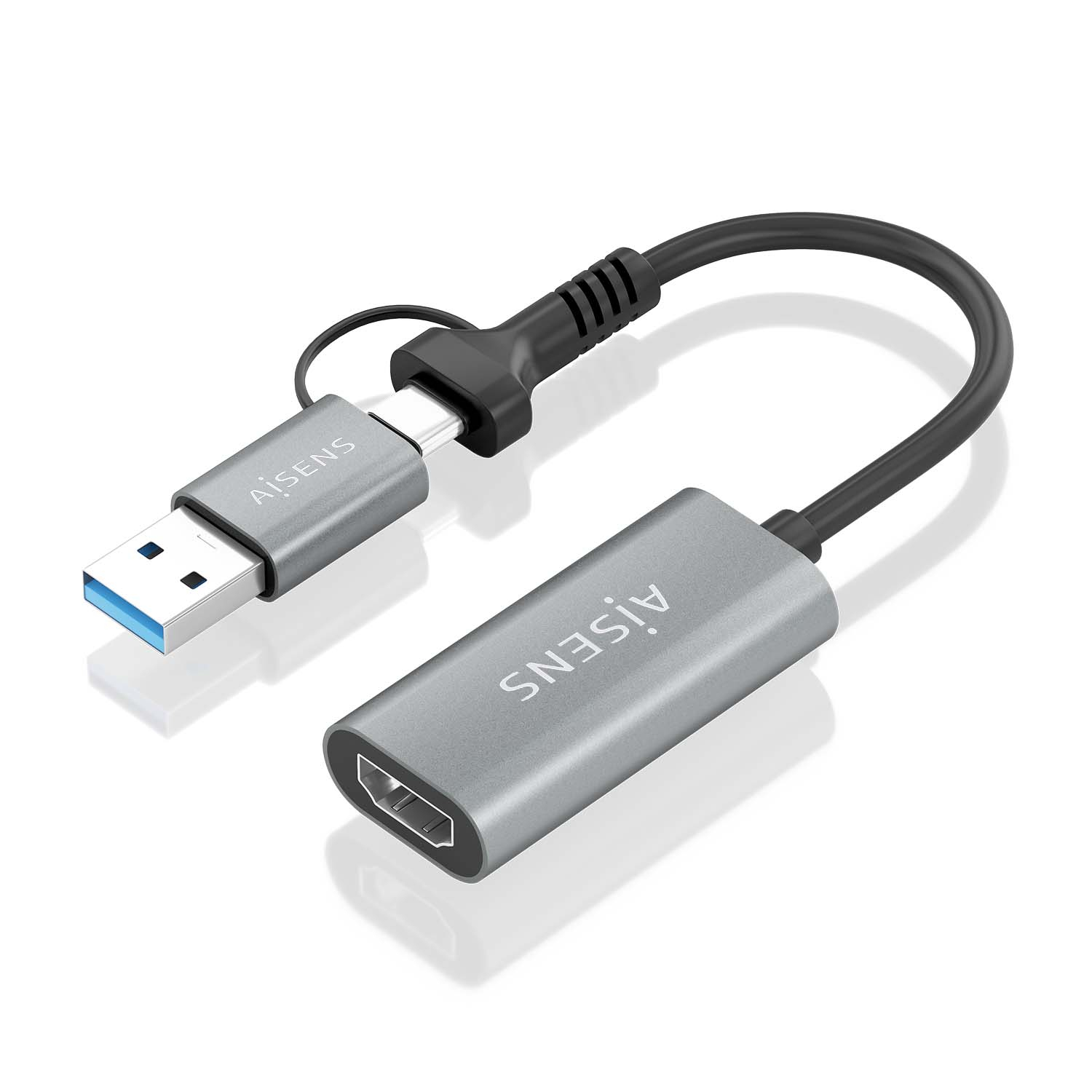 Un adaptador gris Aisens con conectores USB y HDMI, conectado por un cable negro, sobre fondo blanco.