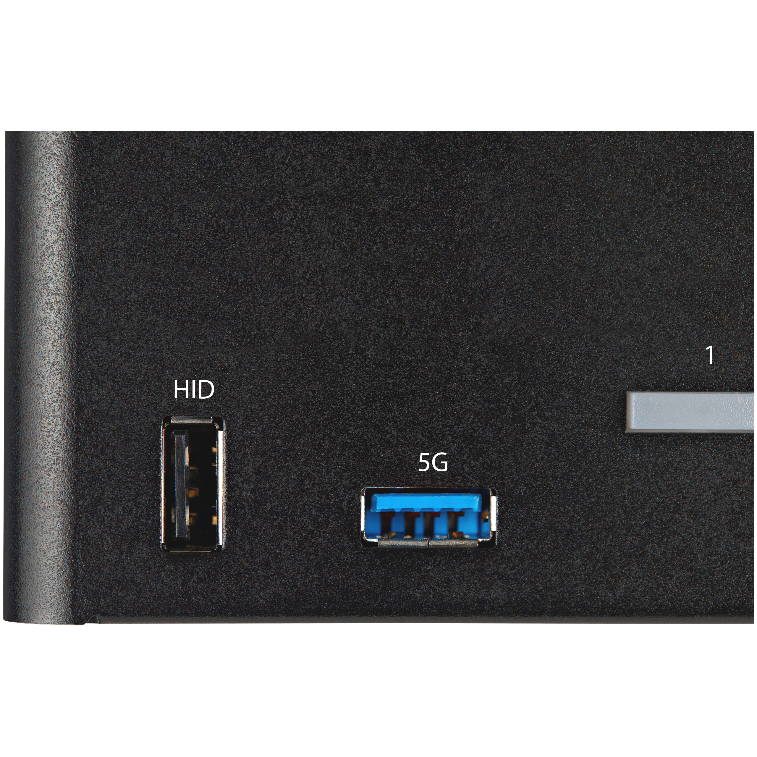 Primo piano di un dispositivo nero con porte USB etichettate HID e 5G. È visibile anche una barra grigia con il numero 1.
