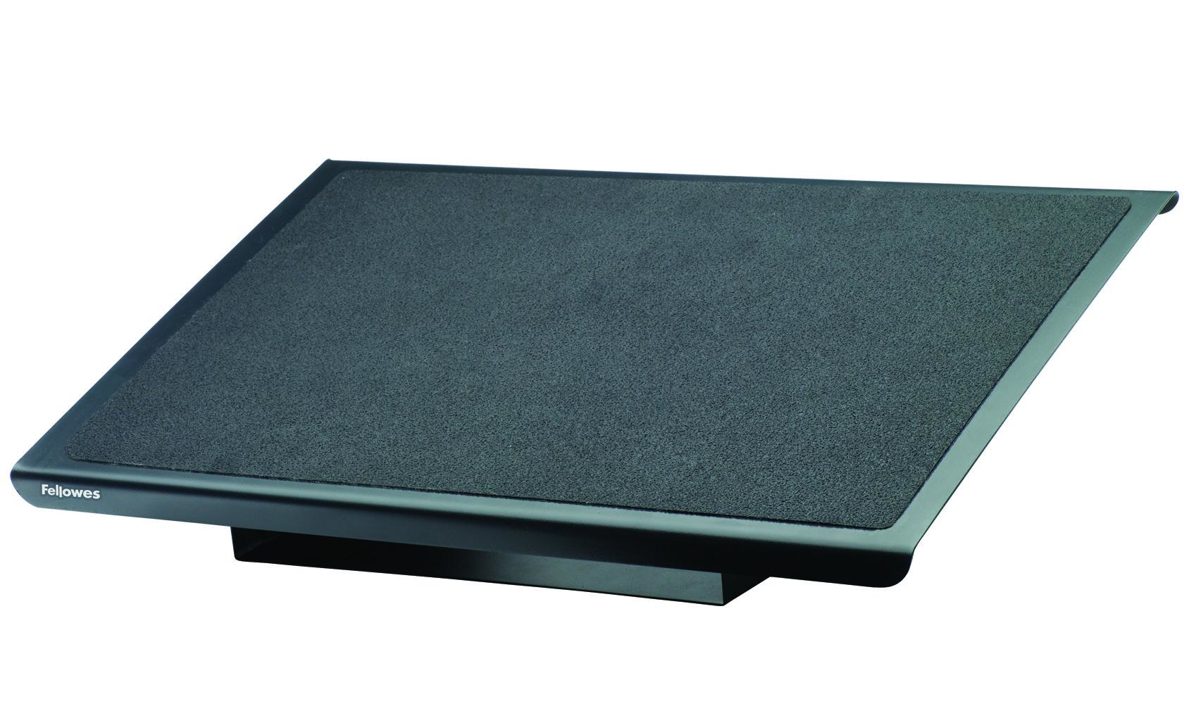 A Fellowes foot rest, black, with a textured surface. It is rectangular and elevated with a small logo on the front left.