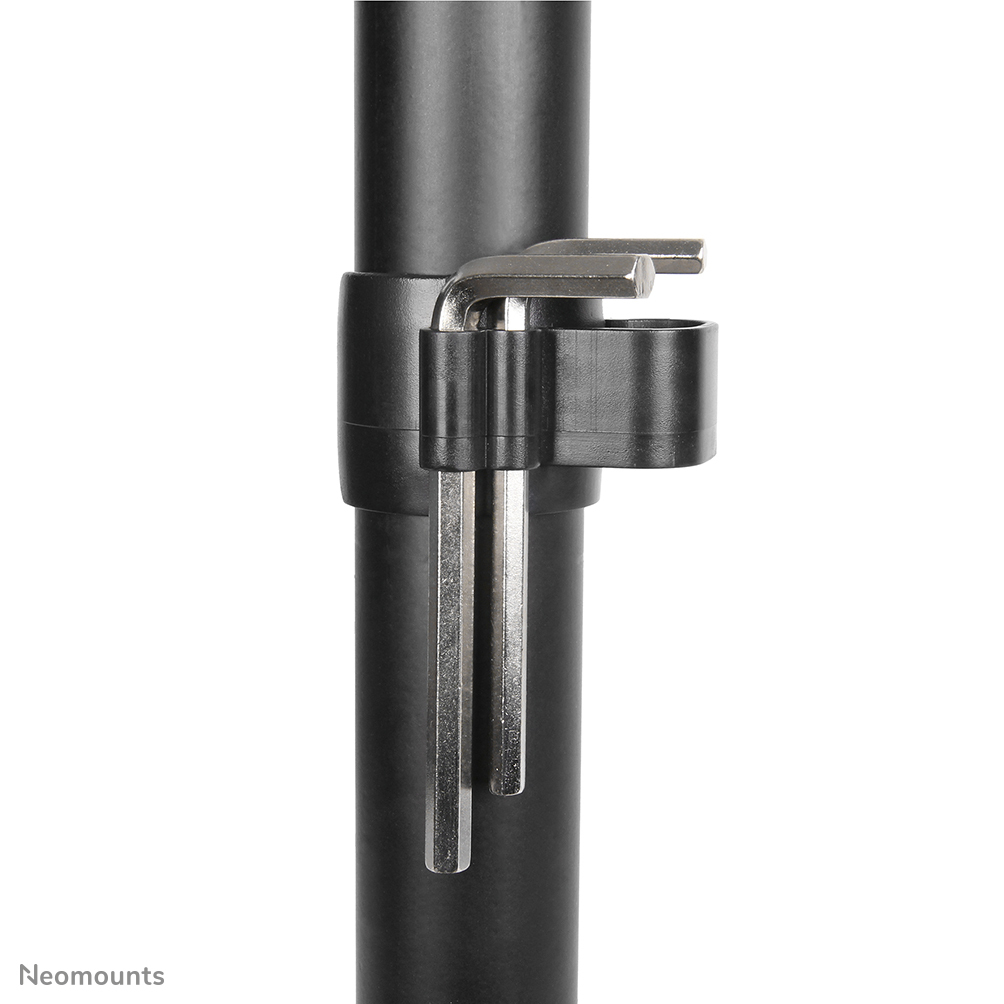 Close-up of a black metal pole with a black plastic holder attached. Allen wrenches are inserted in the holder.