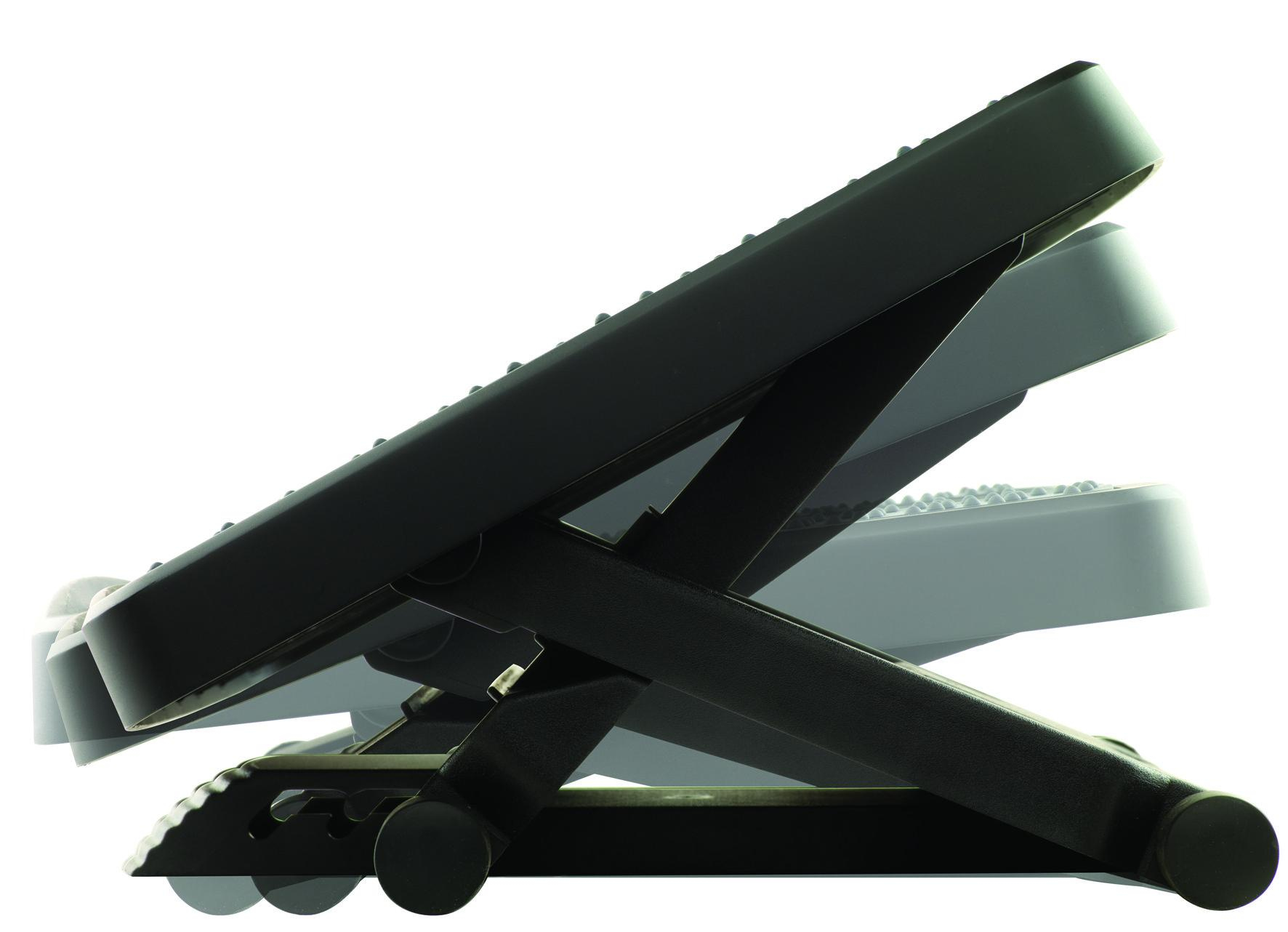 Black adjustable footrest. The footrest is angled upwards. The background is white.