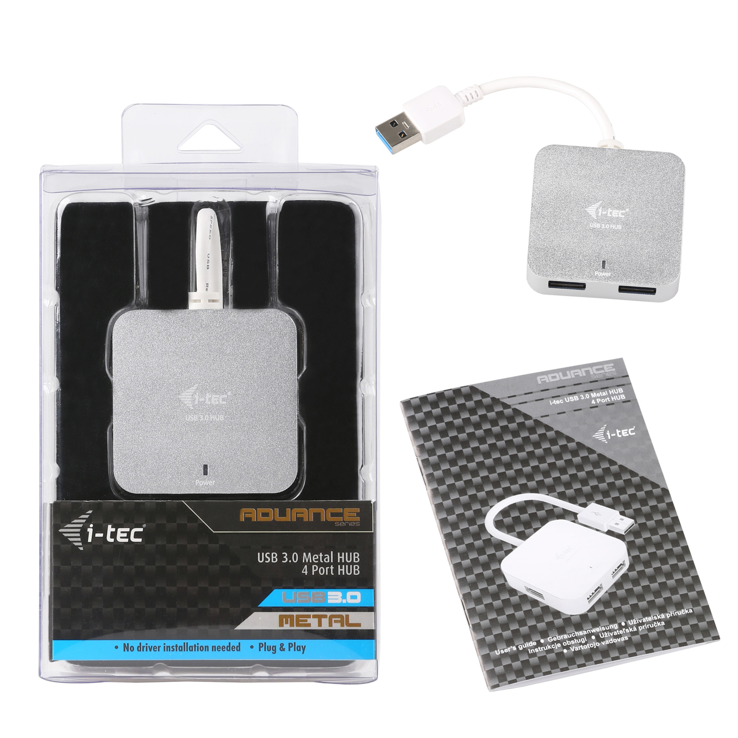 Un HUB USB 3.0 en métal argenté, une boîte et un manuel. Le HUB est dans la boîte et en dehors, et le manuel est à côté.