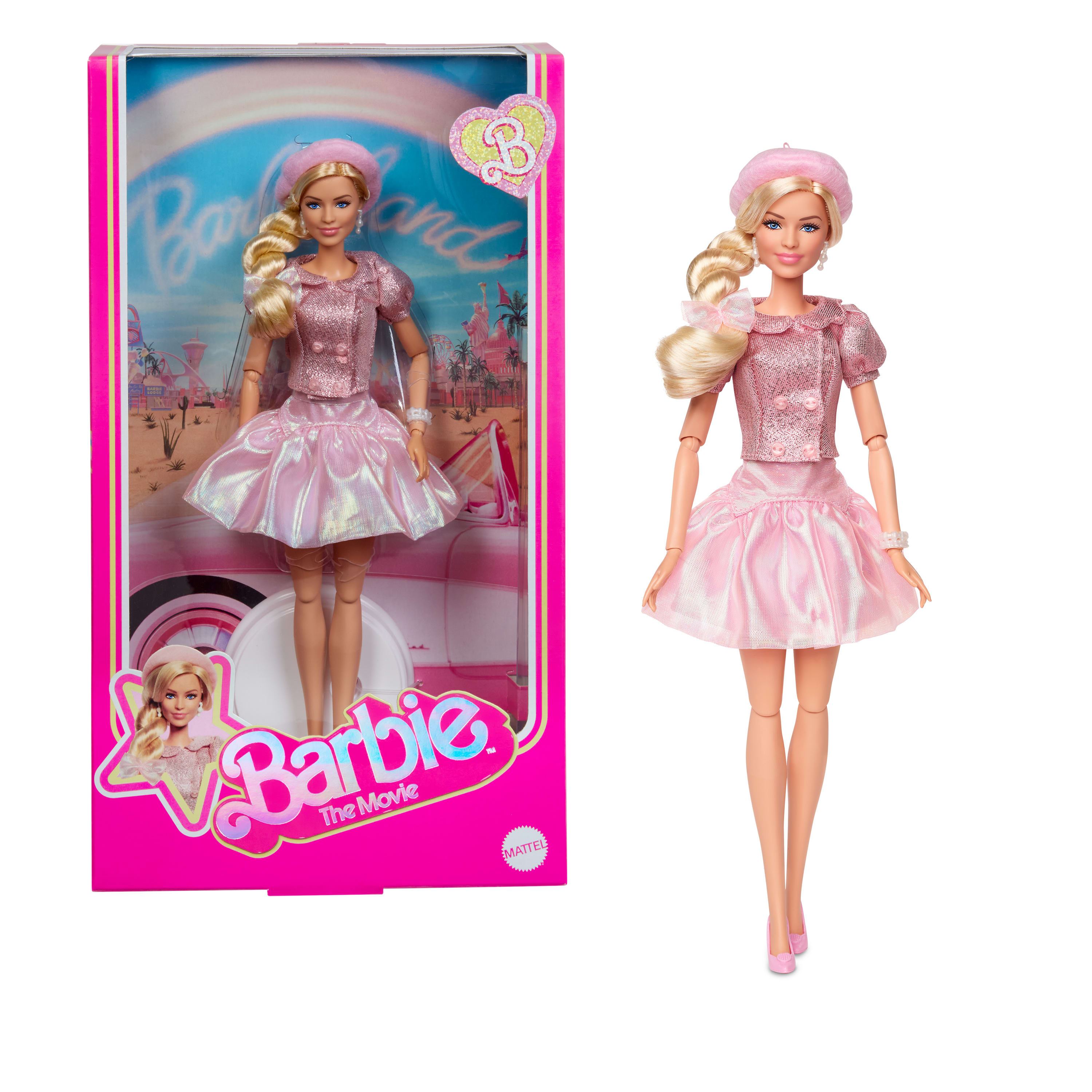 Muñeca Barbie con atuendo rosa, con caja. Barbie lleva boina y falda. La caja es rosa.