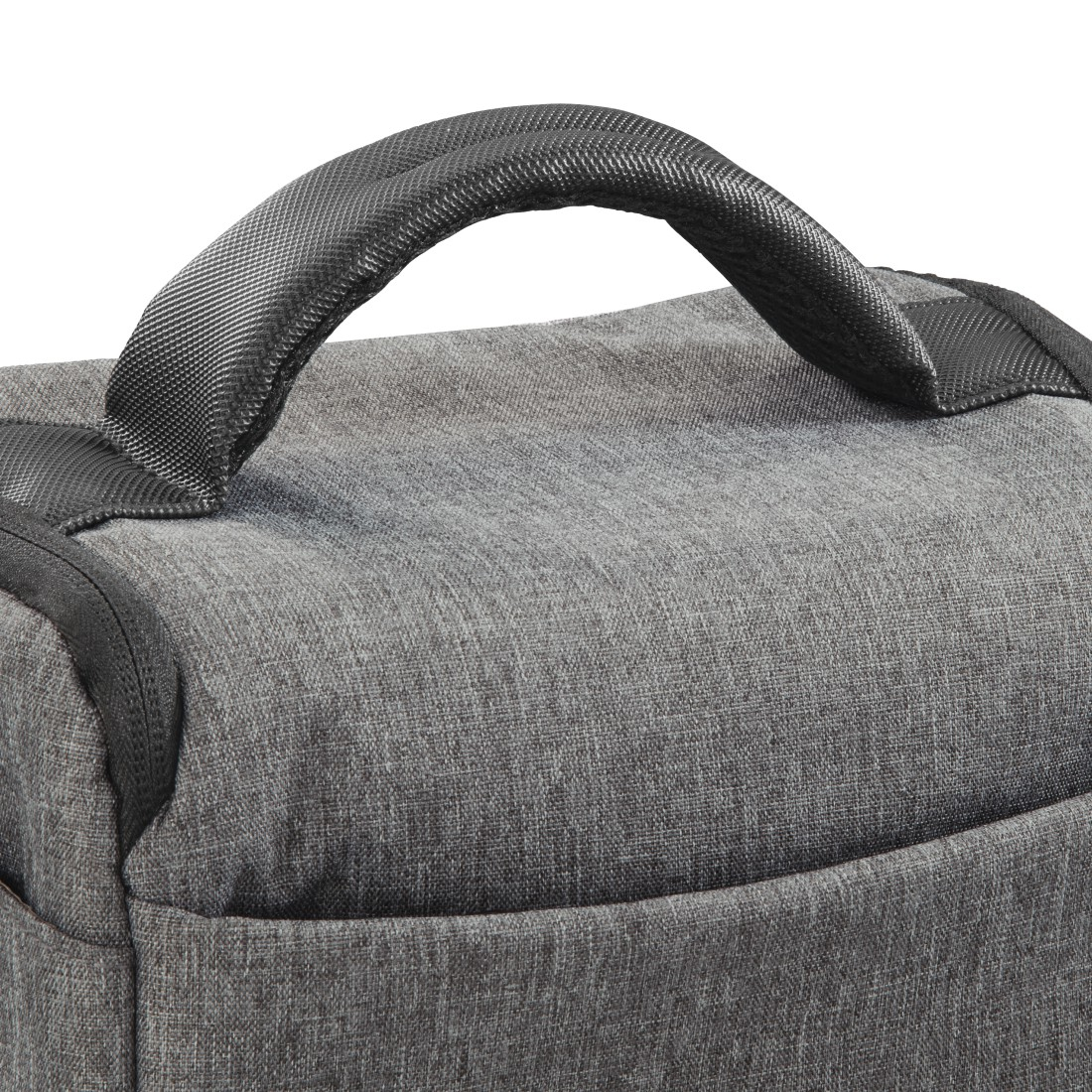 A close-up of a gray bag with a black handle. The handle is arched. The bag is made of gray fabric.