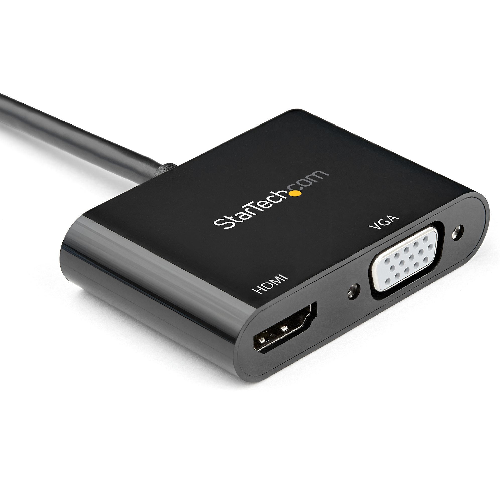 Un adaptador negro de HDMI a VGA con cable, la marca es StarTech.com. Se ven puertos HDMI y VGA.