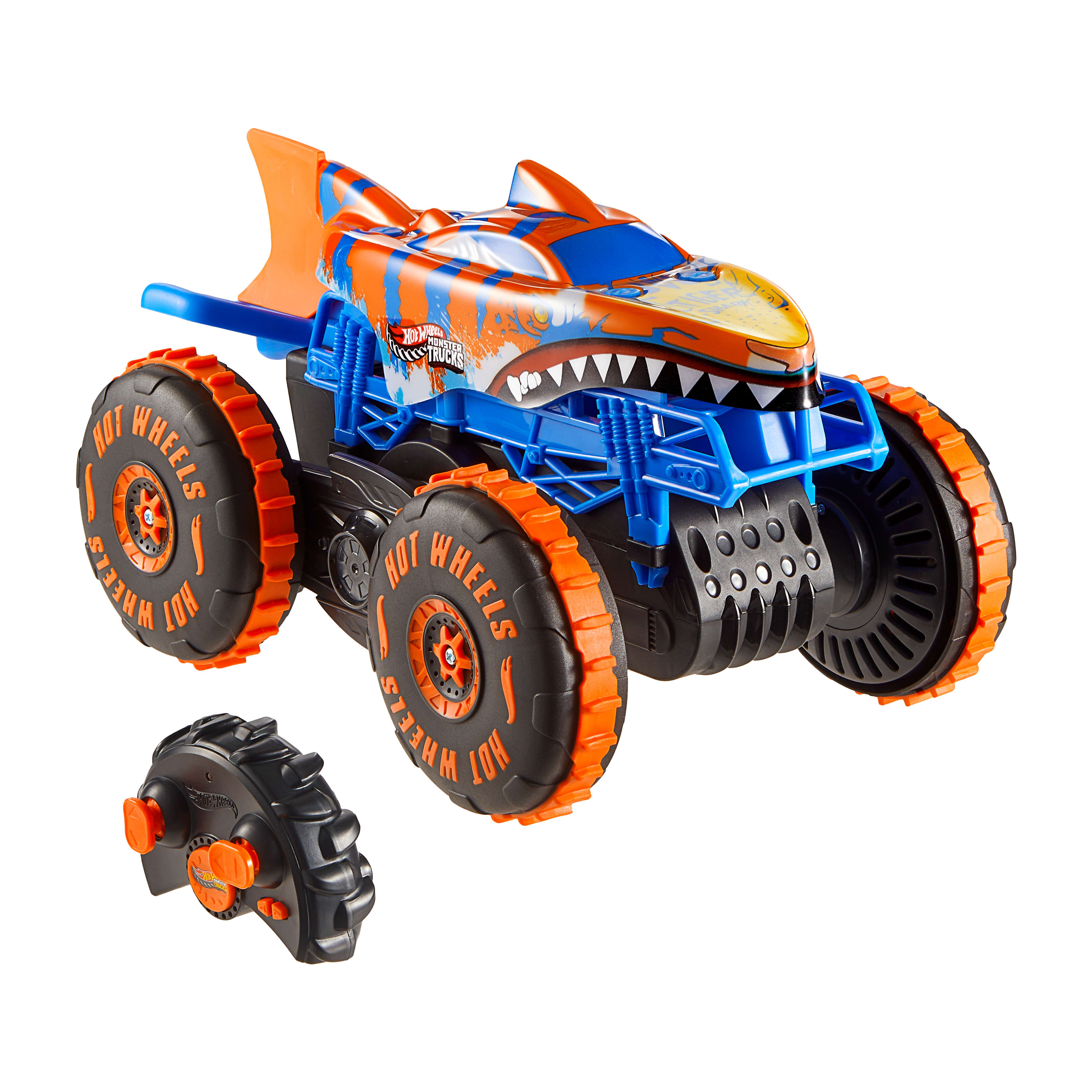 Zabawkowy monster truck Hot Wheels w kolorze niebieskim, pomarańczowym i białym. Zawiera pilota. Design rekina.