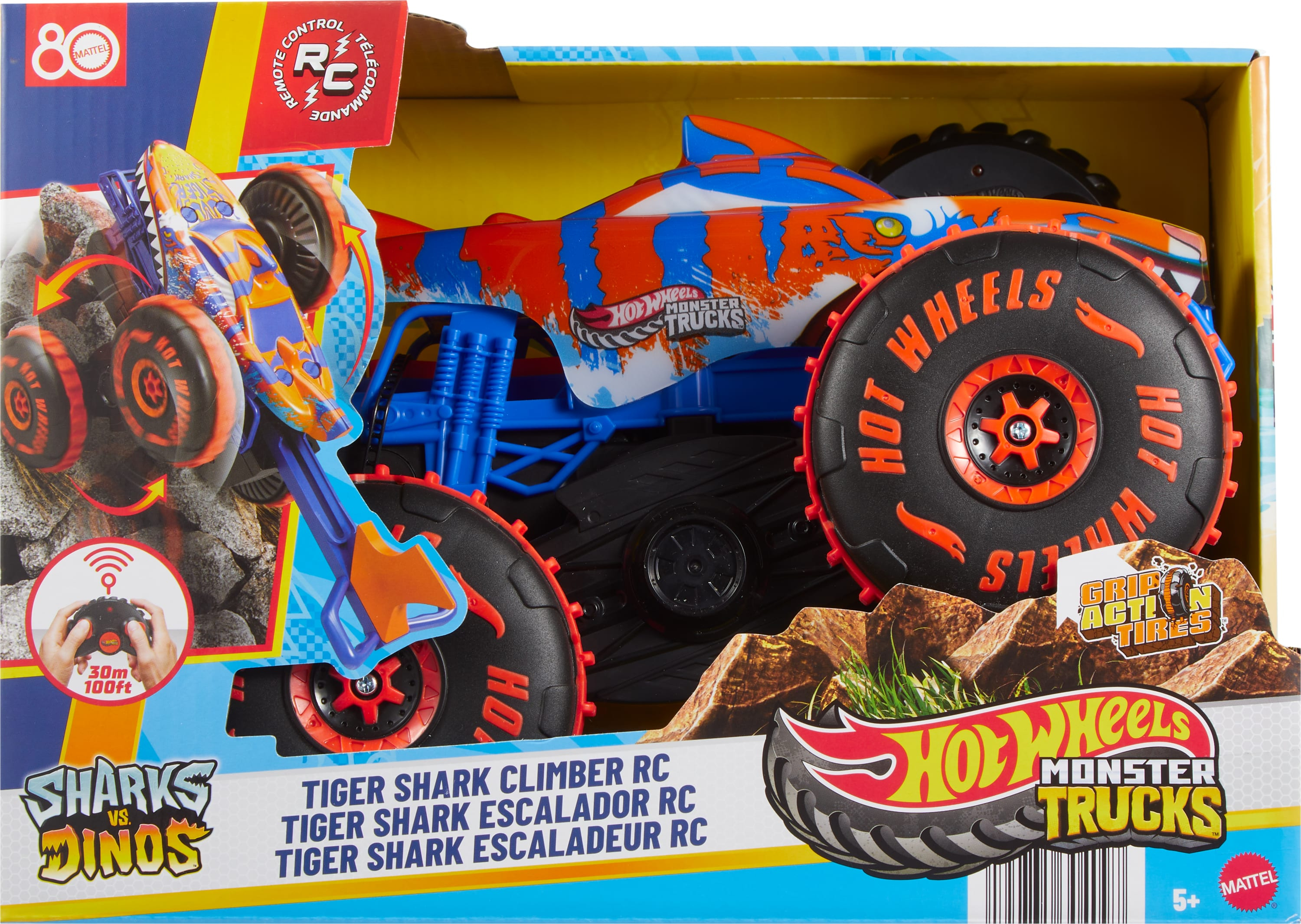 Zabawka Hot Wheels RC Tiger Shark Monster Truck jest w pudełku. Jest pomarańczowy, niebieski i biały.