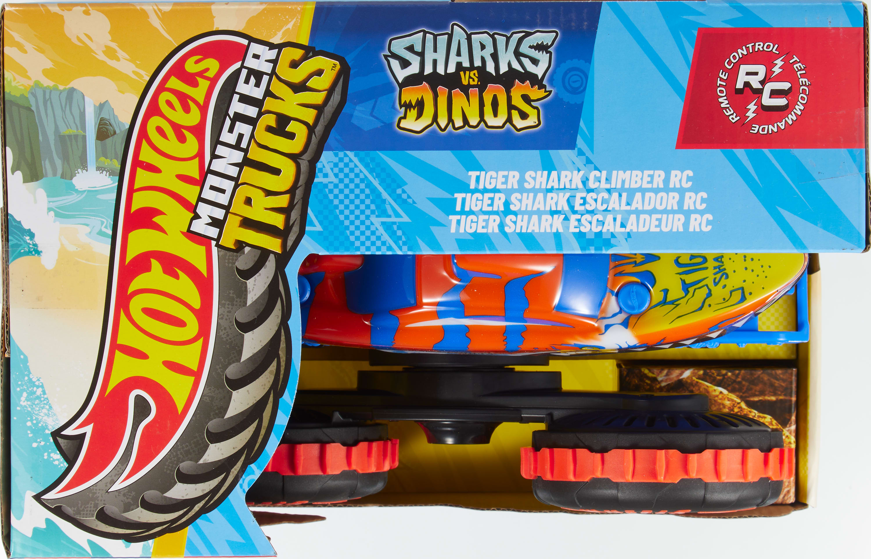 Zapakowana zabawka Hot Wheels Monster Trucks. Zawiera samochód RC Tiger Shark, z niebieskim, pomarańczowym i żółtym designem.