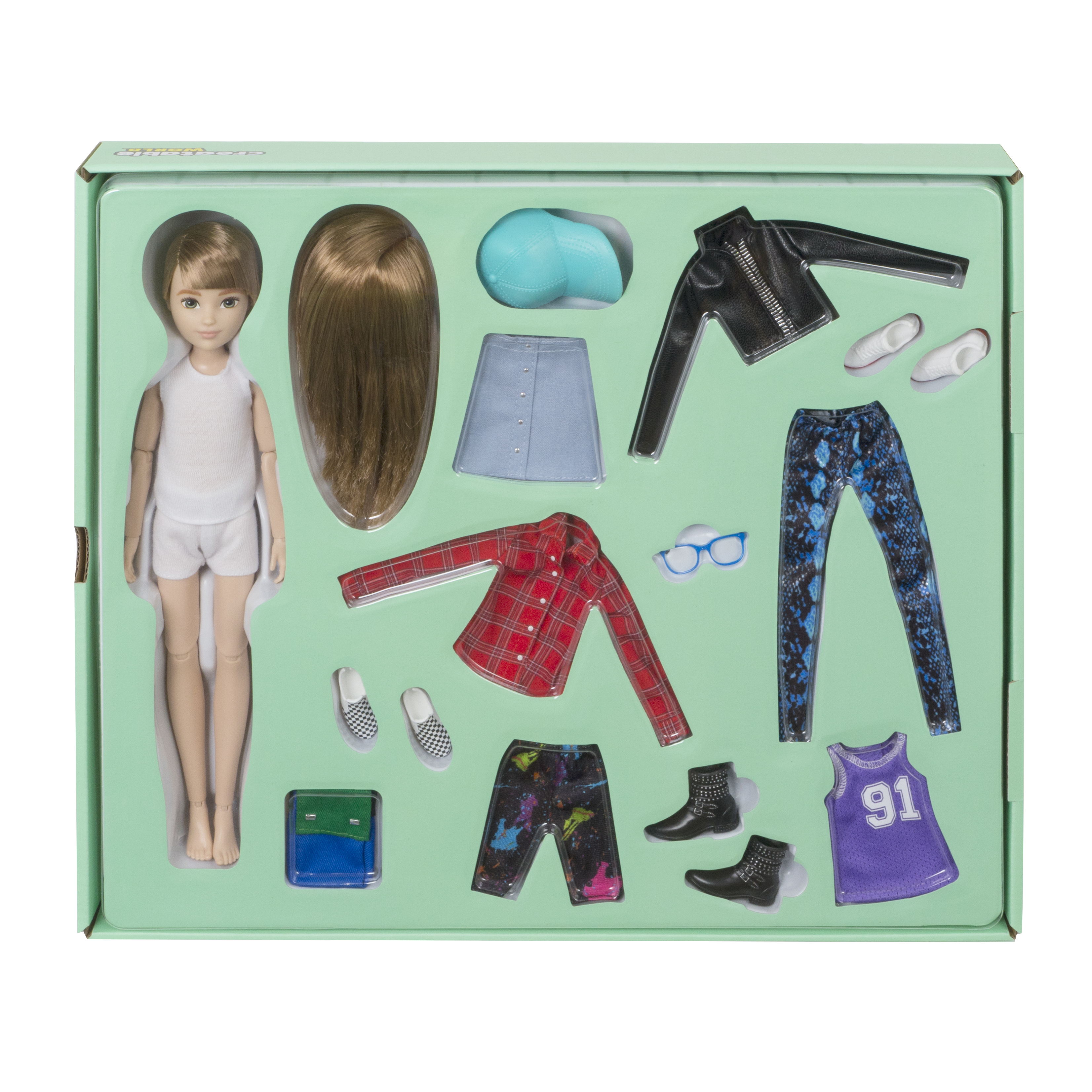 Eine Puppe mit Kleidung und Accessoires in einer Box. Enthält Puppe, Haare, Röcke, Hosen, Hemden, Schuhe, Brille und Stiefel.