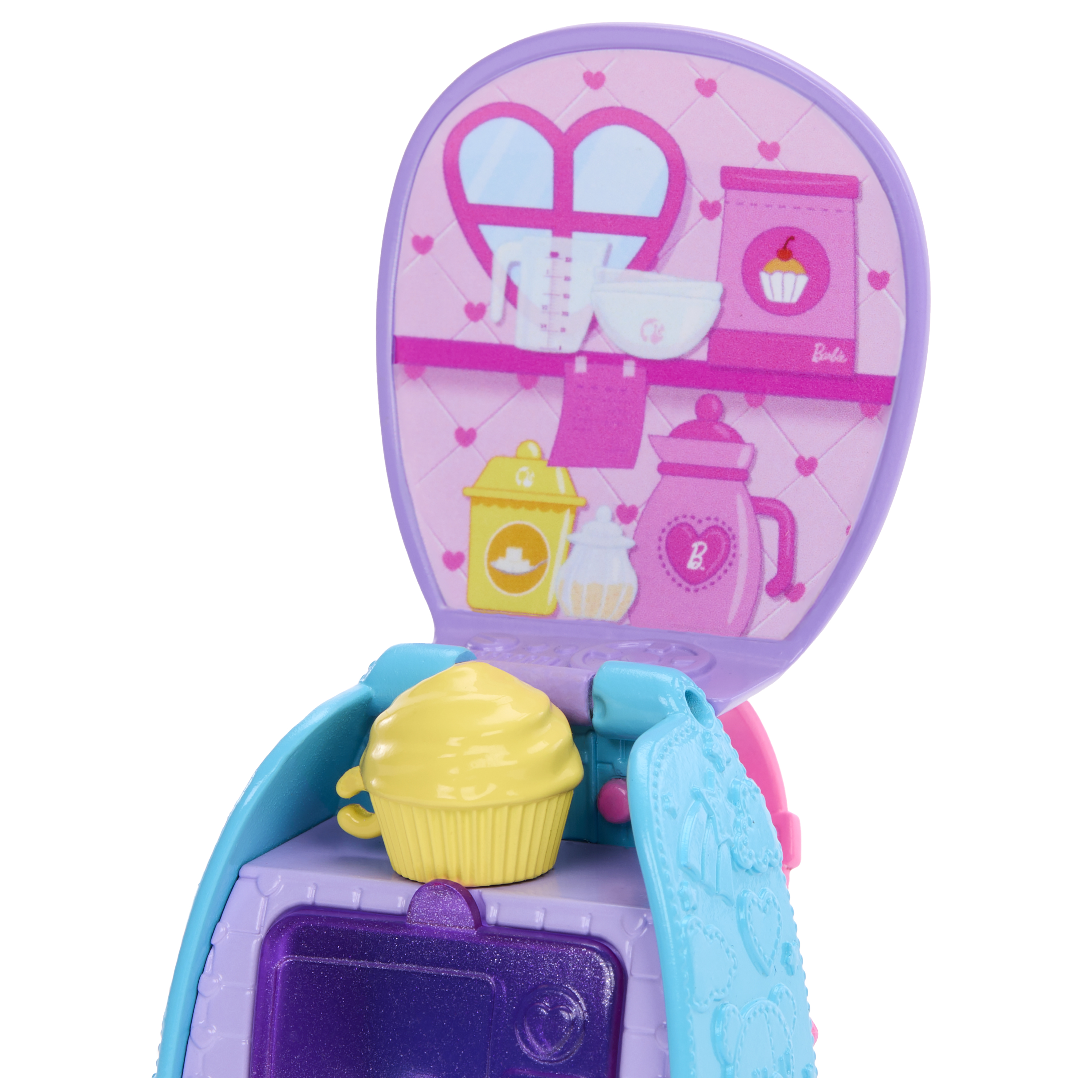 Ein Spielzeug-Küchenset mit einem Cupcake oben. Es hat rosa, blaue und gelbe Elemente mit Herzdesign.