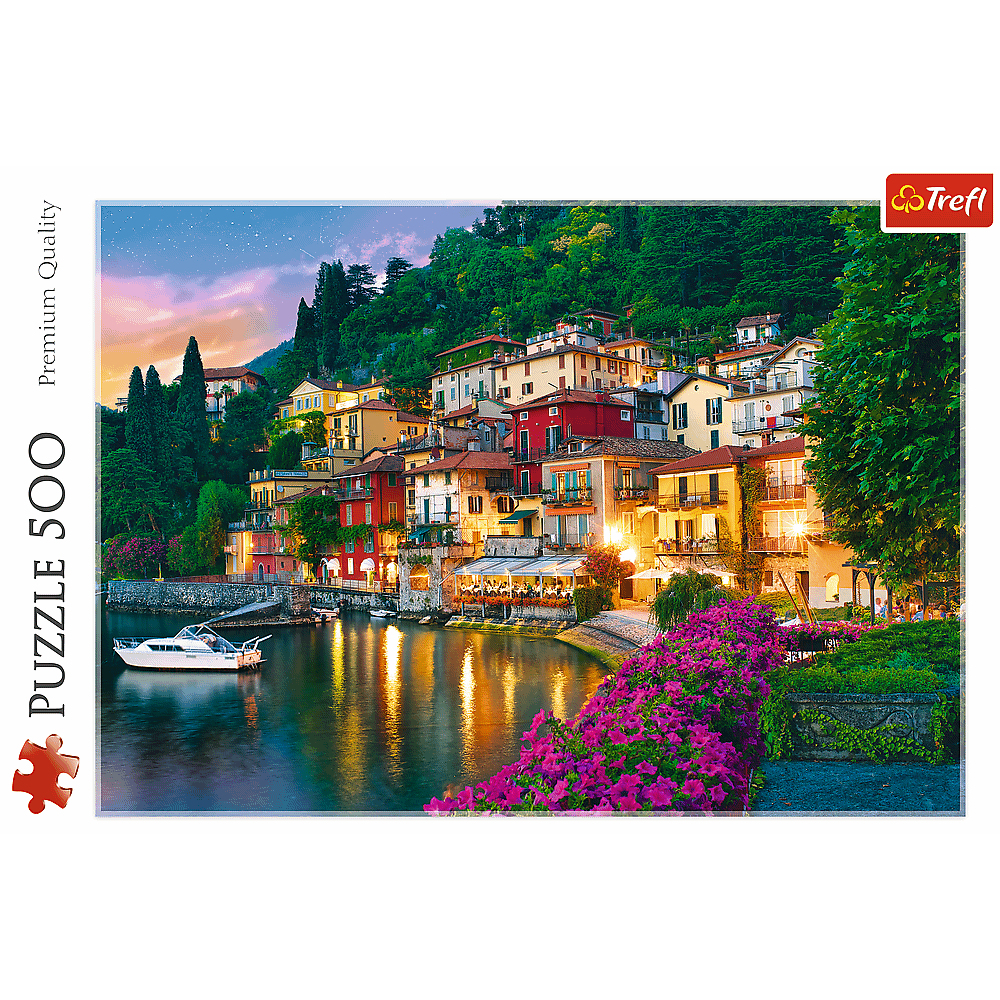 Evening view of a lakeside town with colorful buildings, a boat, and vibrant flowers. The sky has a gradient of pink and purple.