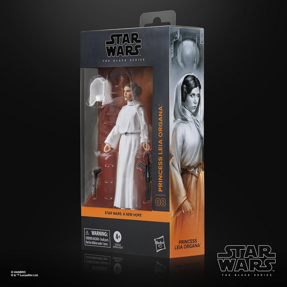 Beyaz elbiseli Prenses Leia'nın bir Star Wars Black Series aksiyon figürü, bir kutu içinde. Kutu Leia'nın resimlerini gösteriyor.