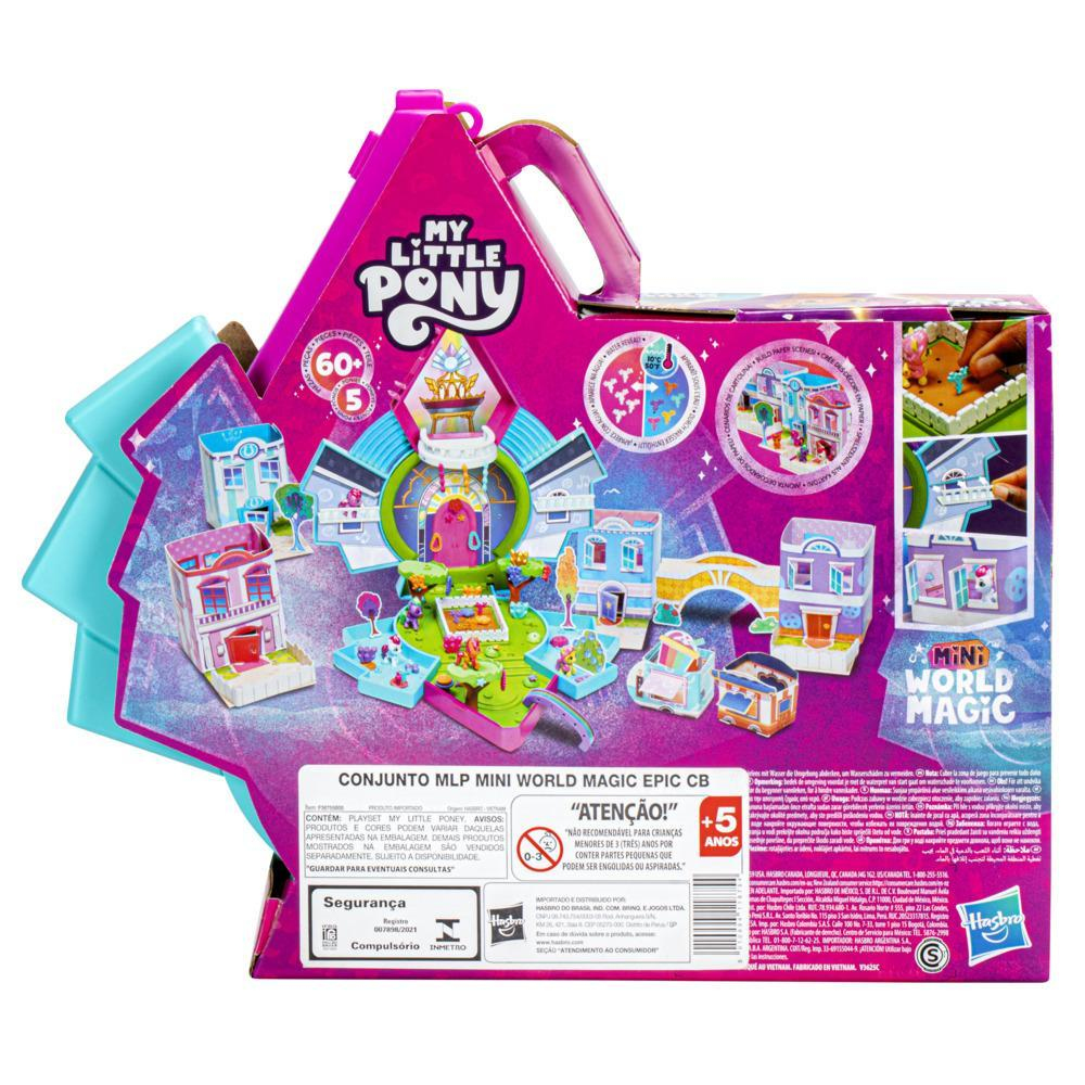Caja de juego de My Little Pony. Muestra un juego con edificios, árboles y pequeñas figuras. La caja es rosa y azul.