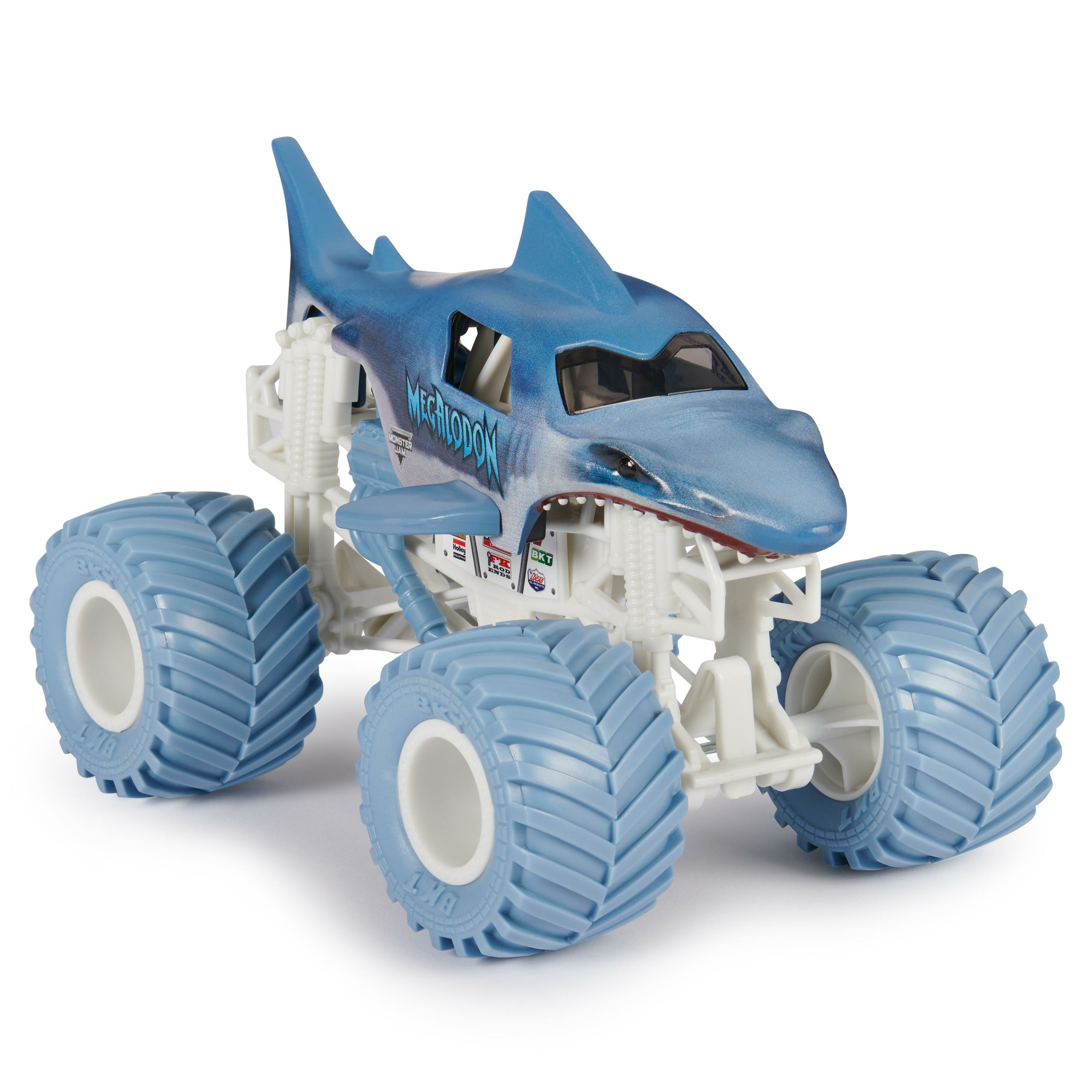 Un camión monstruo de juguete azul con forma de tiburón. Tiene neumáticos grandes y el nombre "MECHLODON".