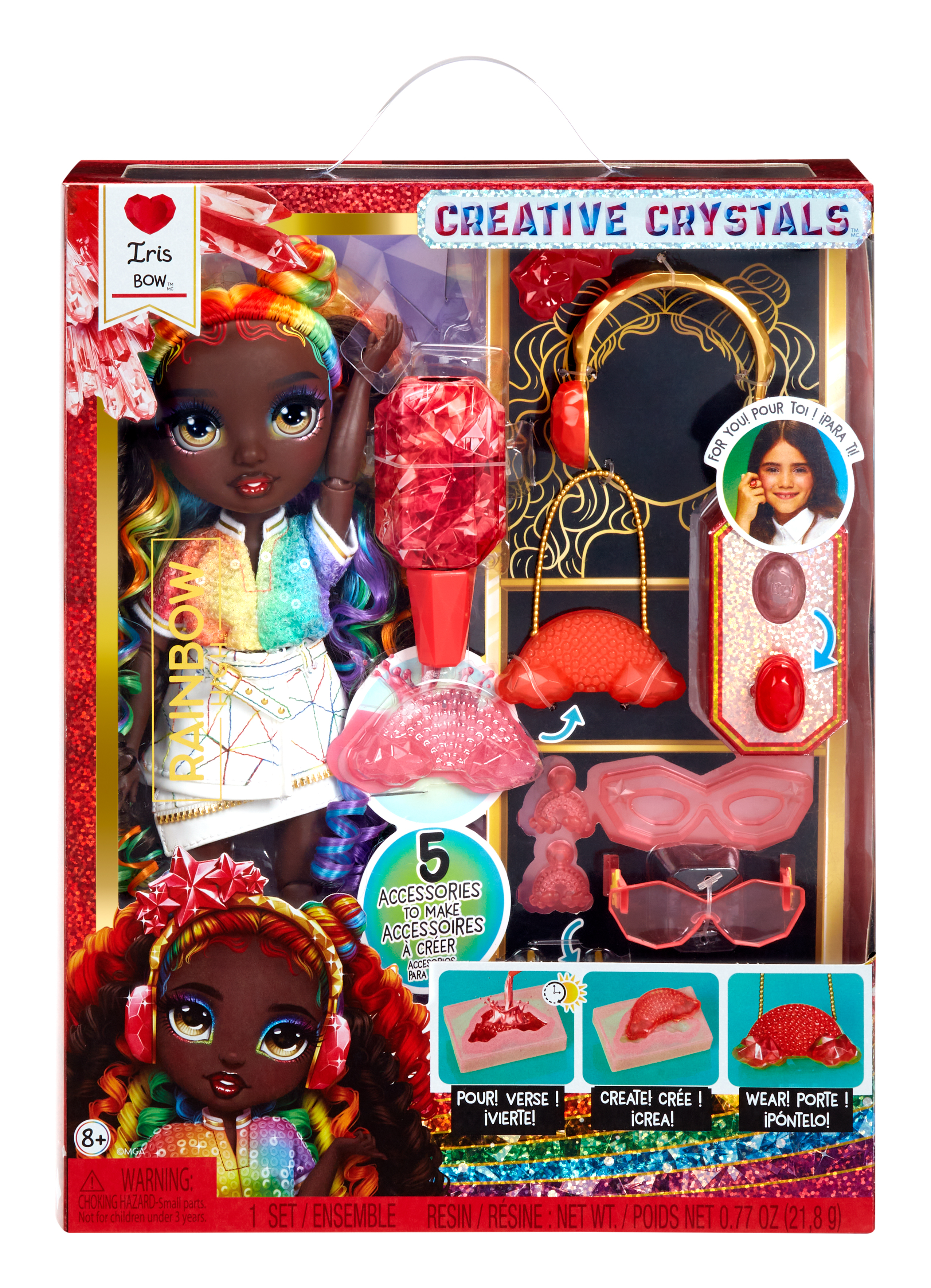 Pudełko z lalką z tęczowymi włosami, akcesoriami i napisem 'Creative Crystals'.