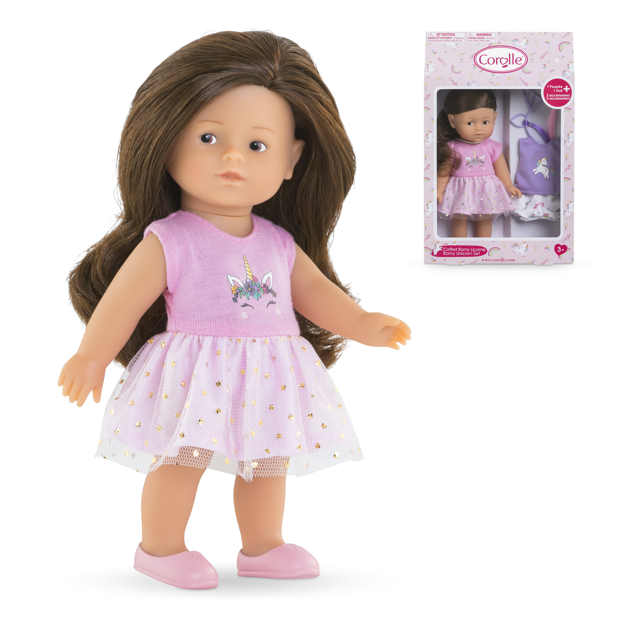Eine Puppe mit braunen Haaren und einem rosa Einhornkleid, neben einer Schachtel mit derselben Puppe und Zubehör.