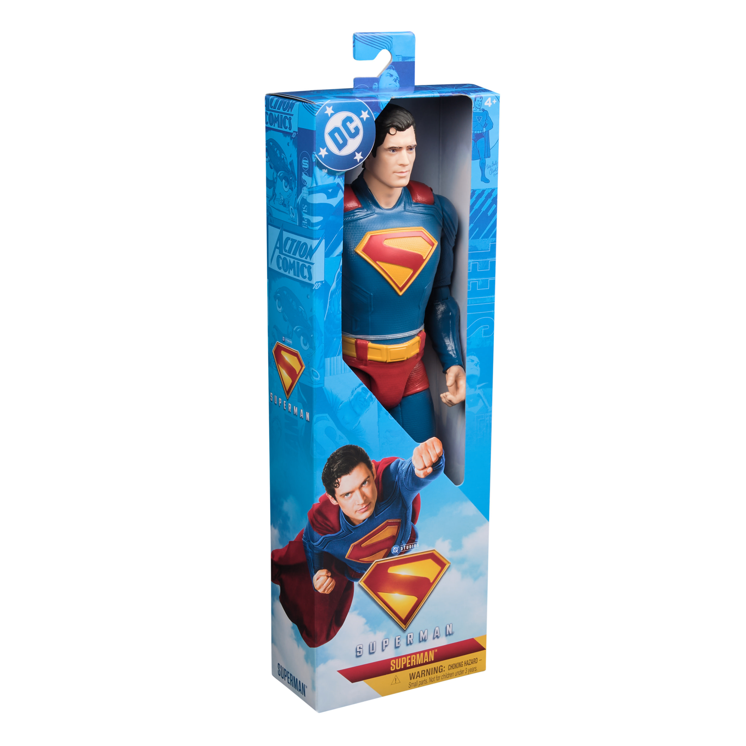 Una figura de acción de Superman en una caja. Es azul, rojo y amarillo. La caja tiene imágenes de Superman.