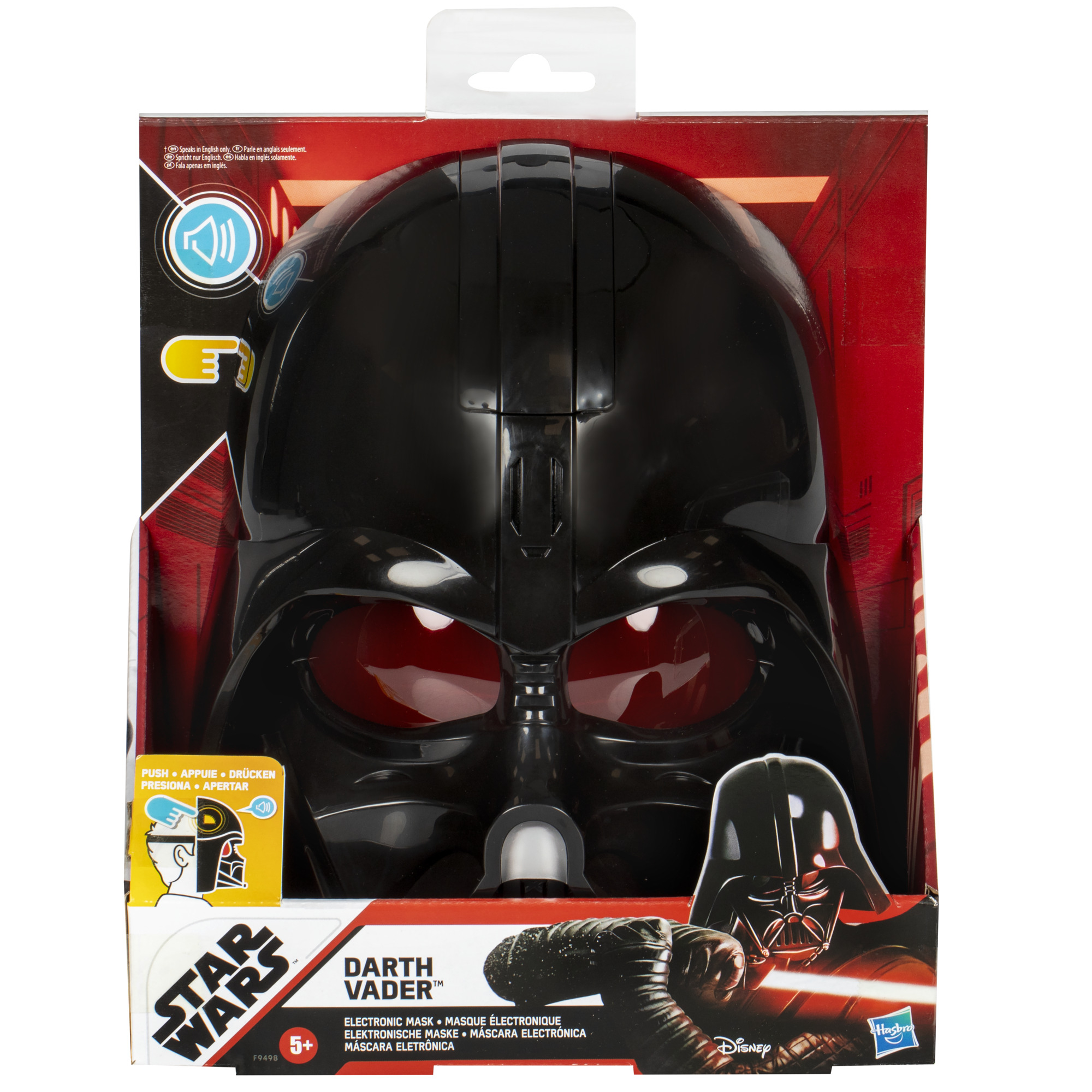 Un juguete de máscara de Darth Vader está en su caja. Tiene lentes rojas y es negro. La caja es roja y negra con la marca Star Wars.