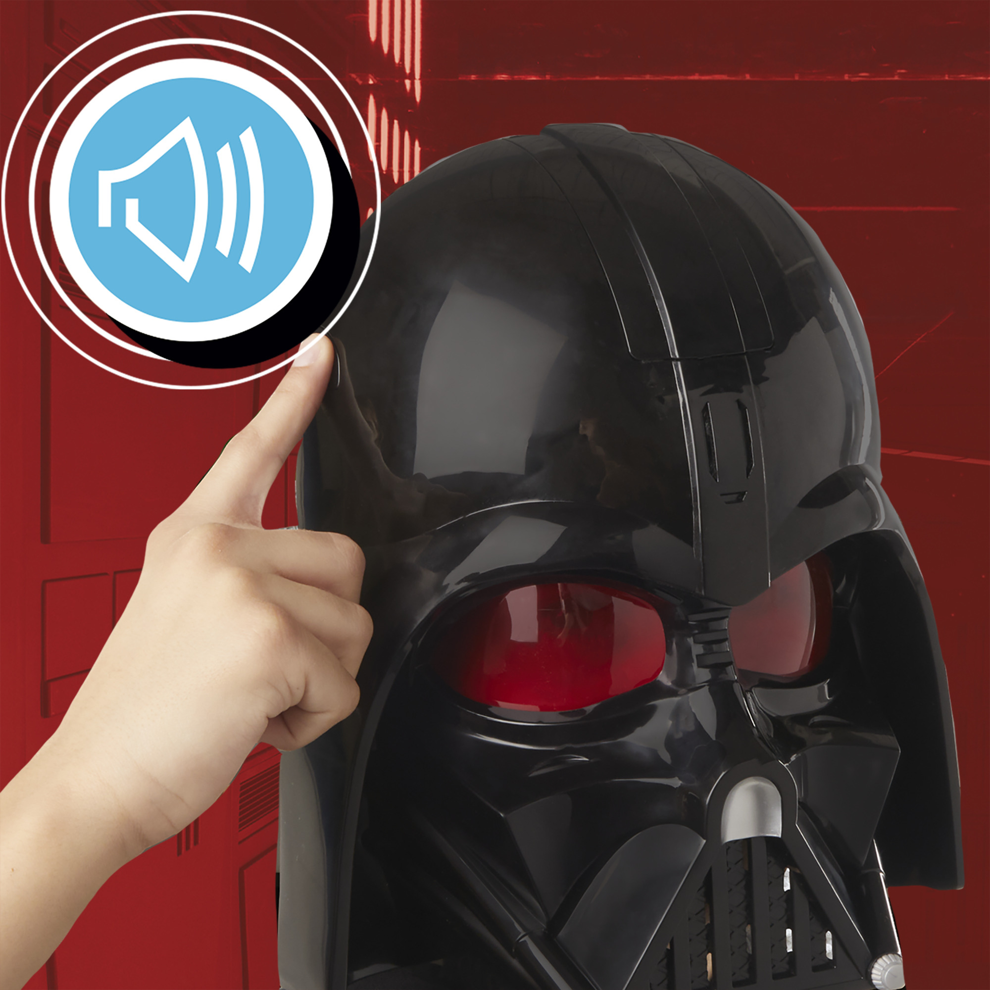 Una mano toca una máscara de Darth Vader con lentes rojas. Un icono de altavoz está en la parte superior izquierda. El fondo es rojo.