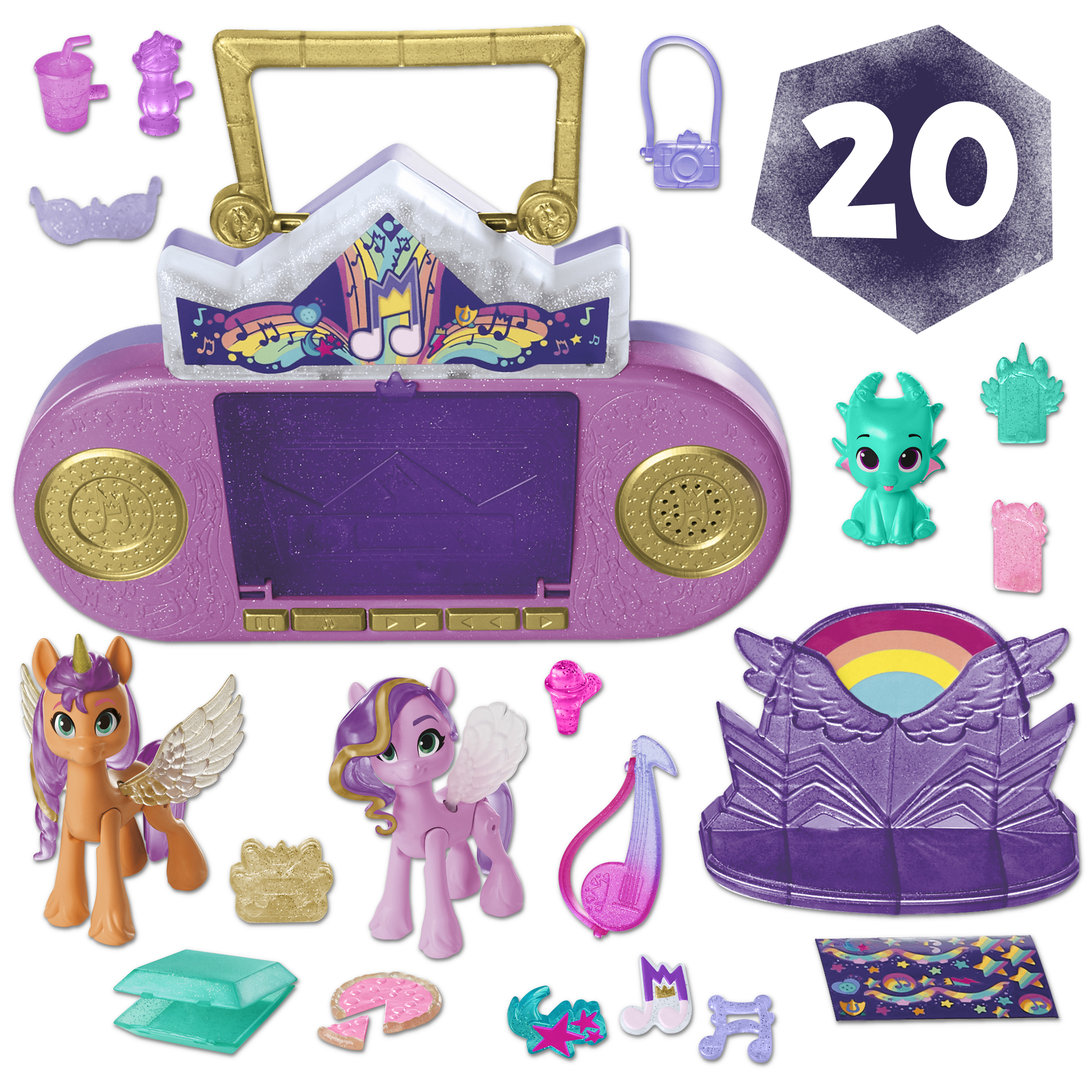 Obraz przedstawia zabawki i akcesoria My Little Pony, w tym figurki, radio i różne przedmioty związane z muzyką.