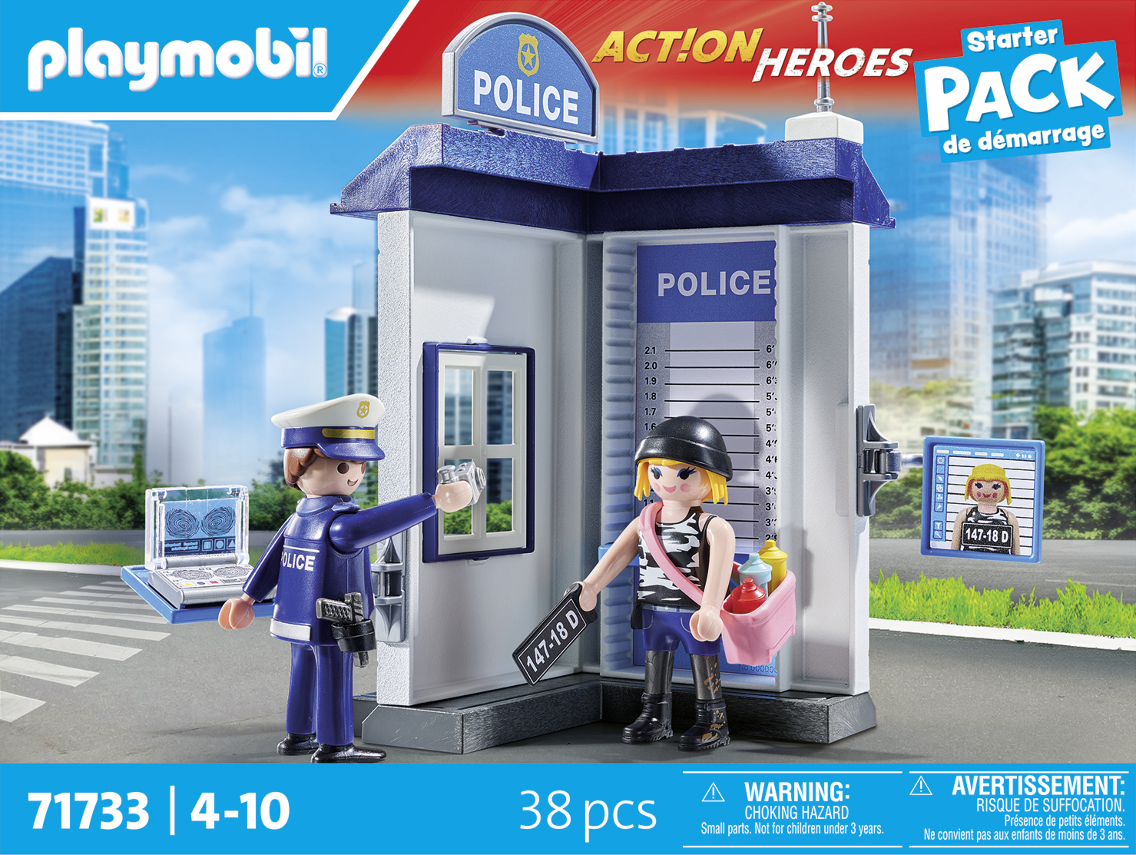 Zestaw posterunku policji Playmobil z dwiema figurkami, laptopem i więźniem. Tłem jest miasto.