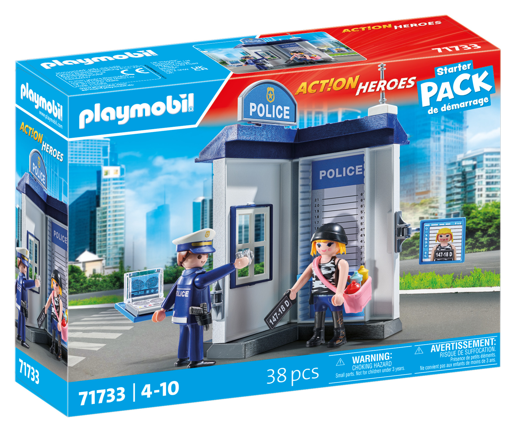 Zestaw posterunku policji Playmobil z figurkami. Policjant z laptopem, kobieta z torbą, przed posterunkiem. Tło miasta.