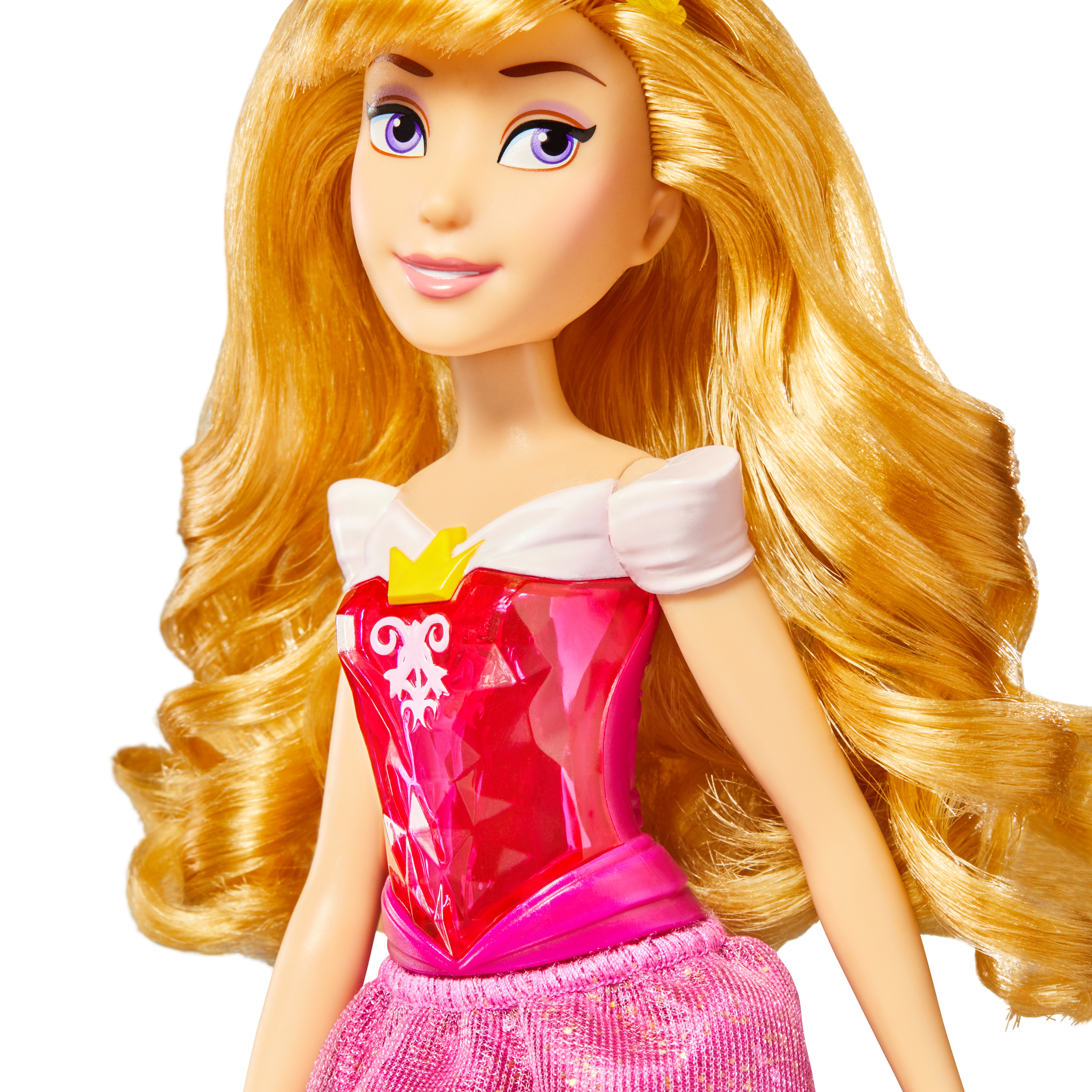 Una bambola della Principessa Aurora. Ha i capelli biondi e indossa un vestito rosa. Il suo viso è dettagliato.