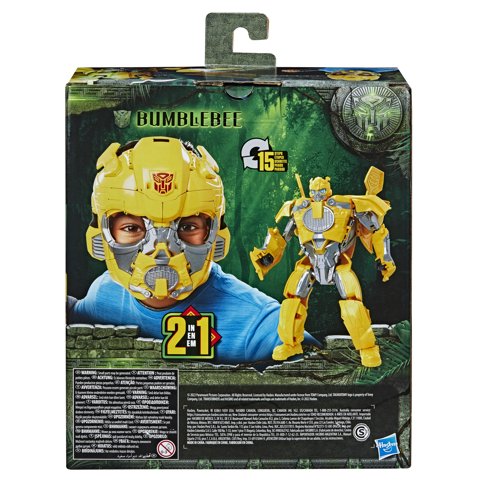 La caja muestra a un niño con una máscara de Bumblebee y un juguete transformador amarillo. También hay texto y advertencias.