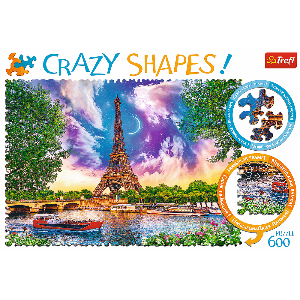 A Crazy Shapes puzzle box showing the Eiffel Tower at sunset with a boat on the river and a crescent moon.