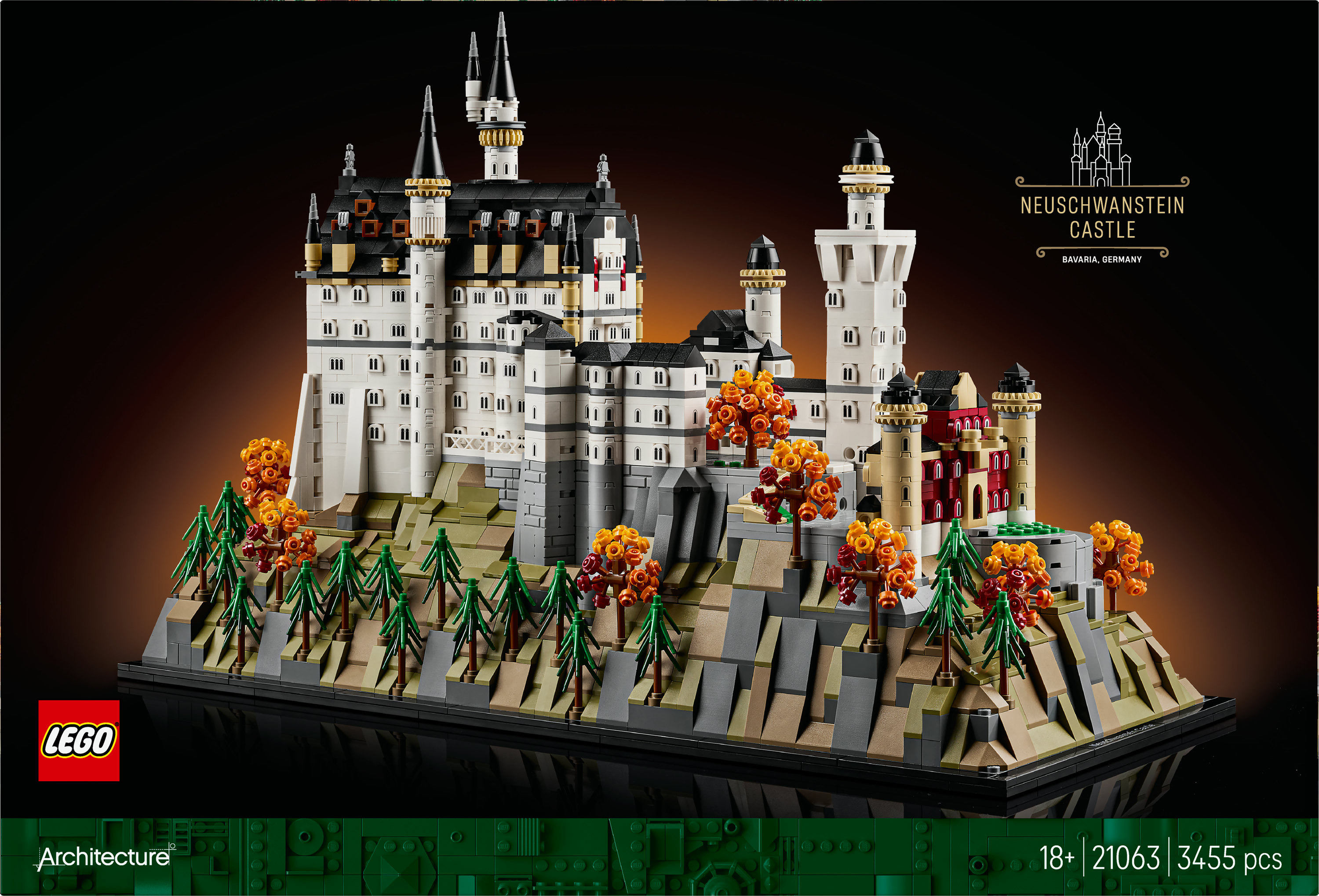 Model LEGO zamku Neuschwanstein. Ma białe ściany, czarne dachy i stoi na zielonej i brązowej podstawie.