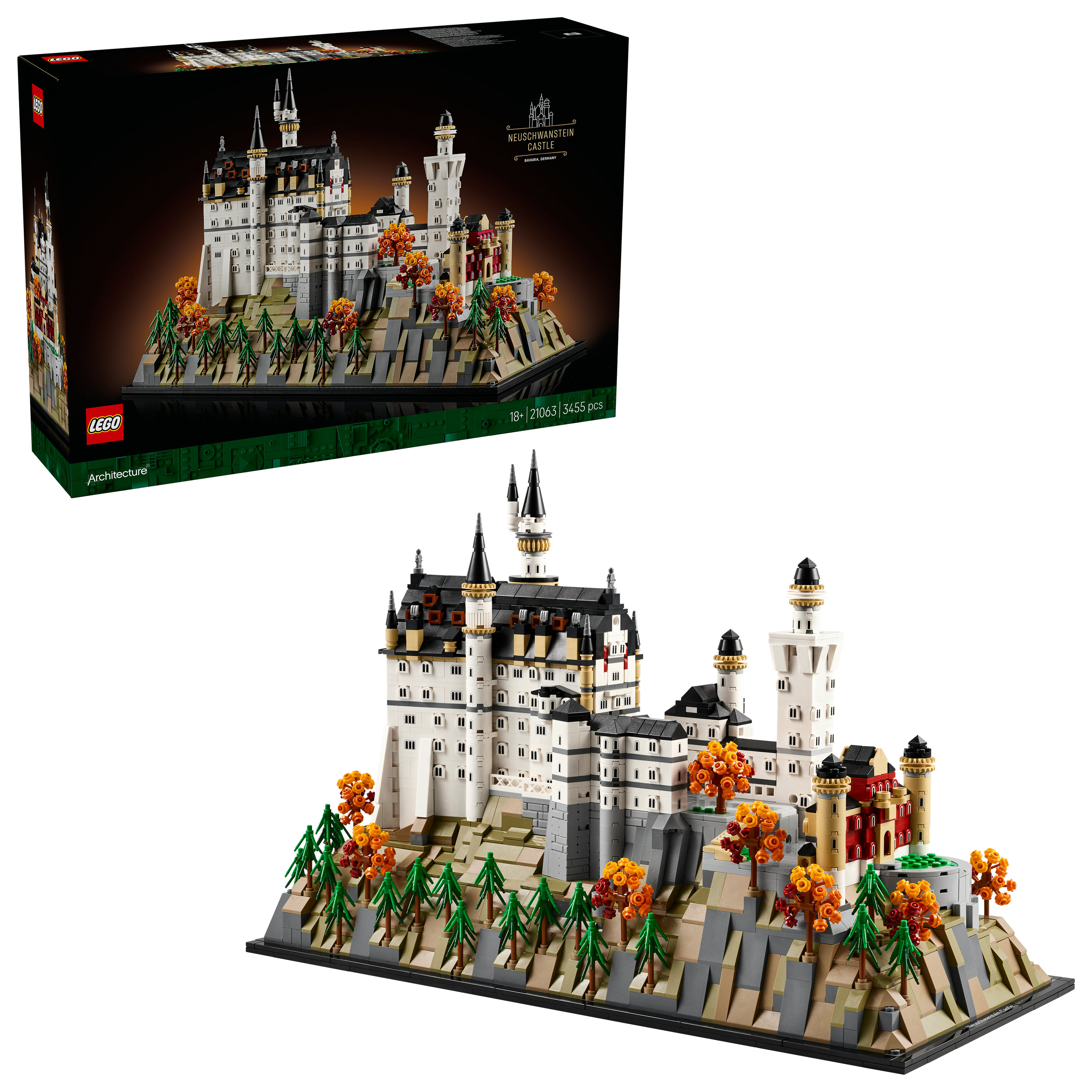 Zestaw Lego Zamek Neuschwanstein. Zamek jest biało-szary na skalistej podstawie, z drzewami.