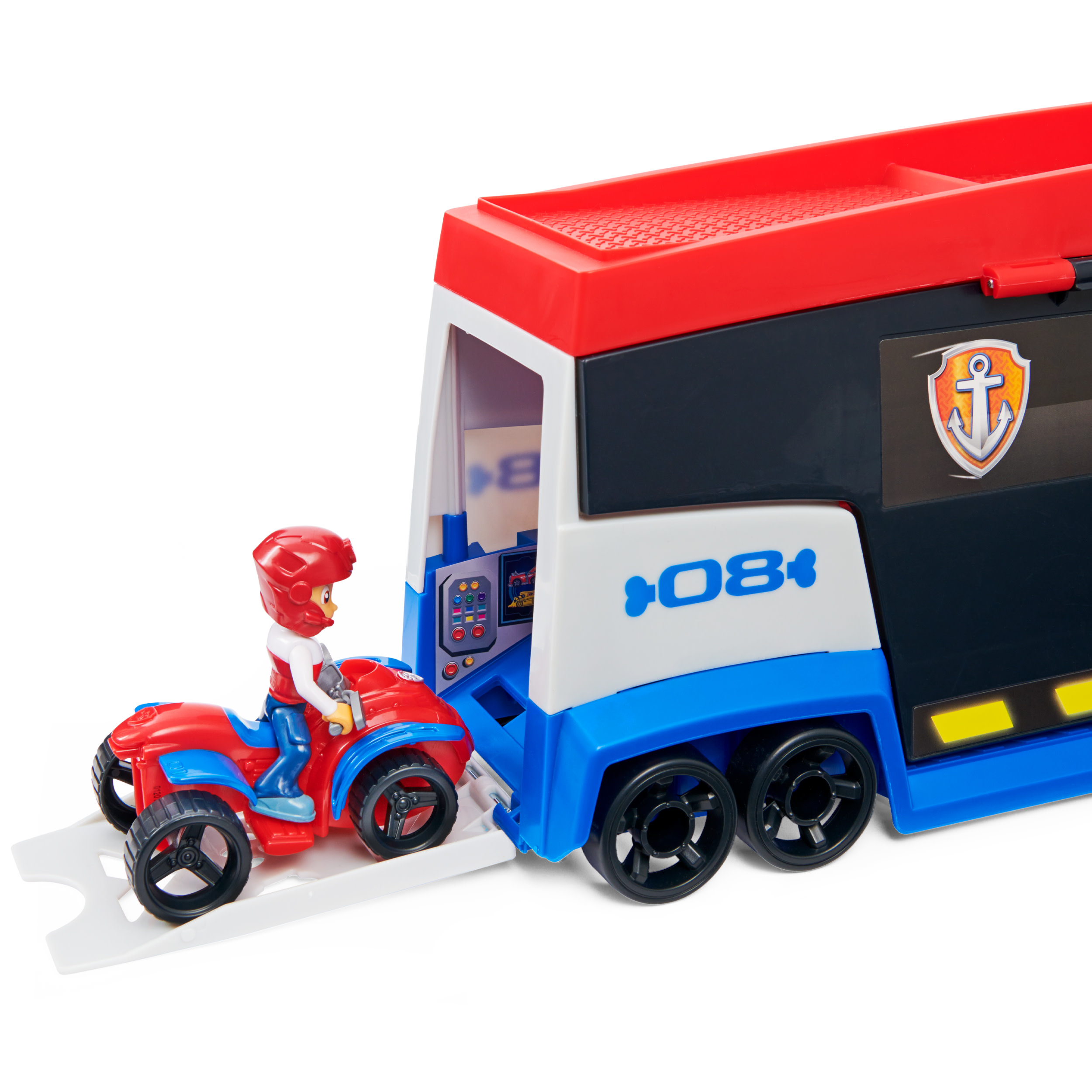 Ein rotes ATV mit Fahrer verlässt einen rot-blau-weißen Paw Patrol-Transporter mit Ankerlogo.
