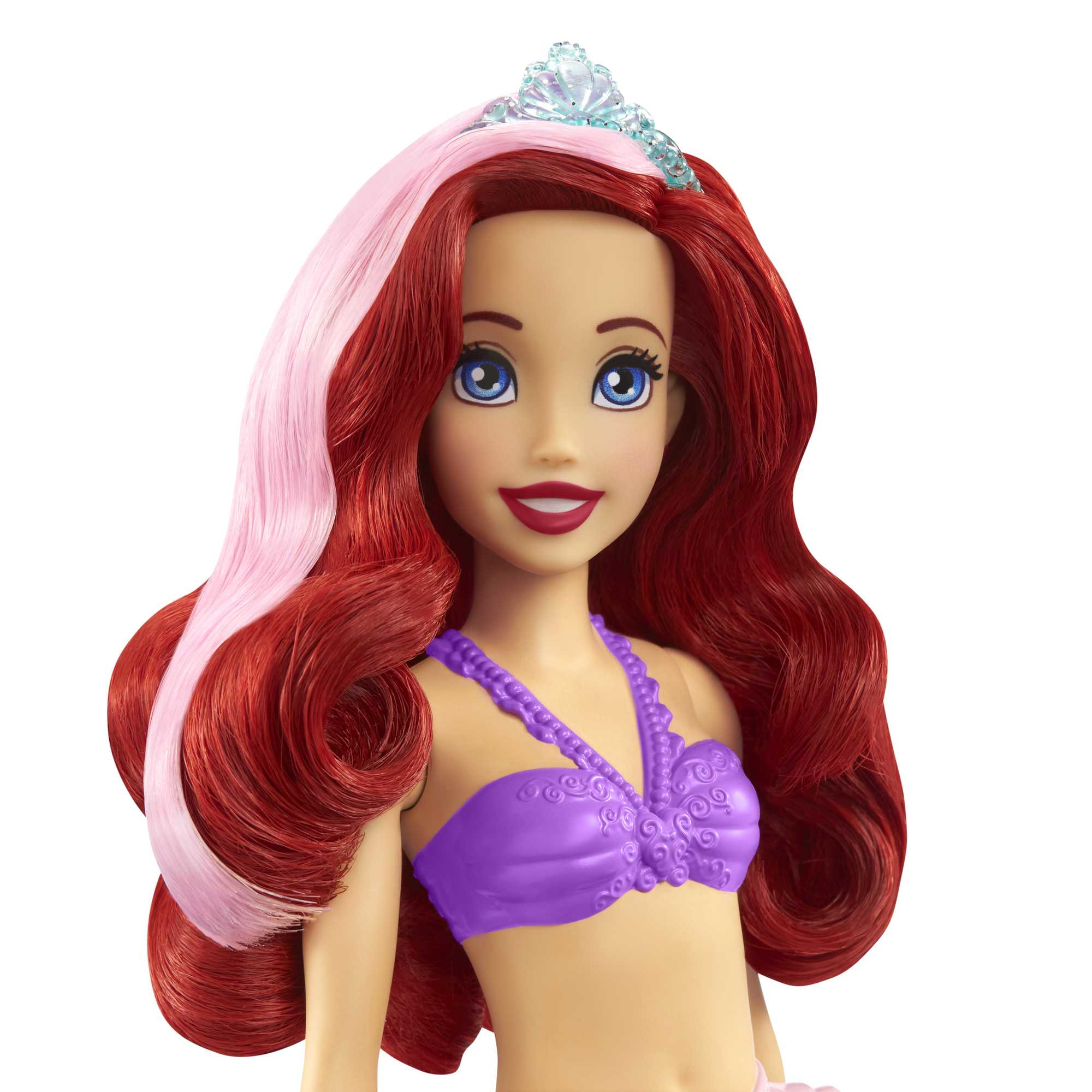 Ariel-Puppe mit rotem und rosa Haar, blauen Augen und einem lila Oberteil. Auf ihrem Kopf befindet sich eine Tiara.