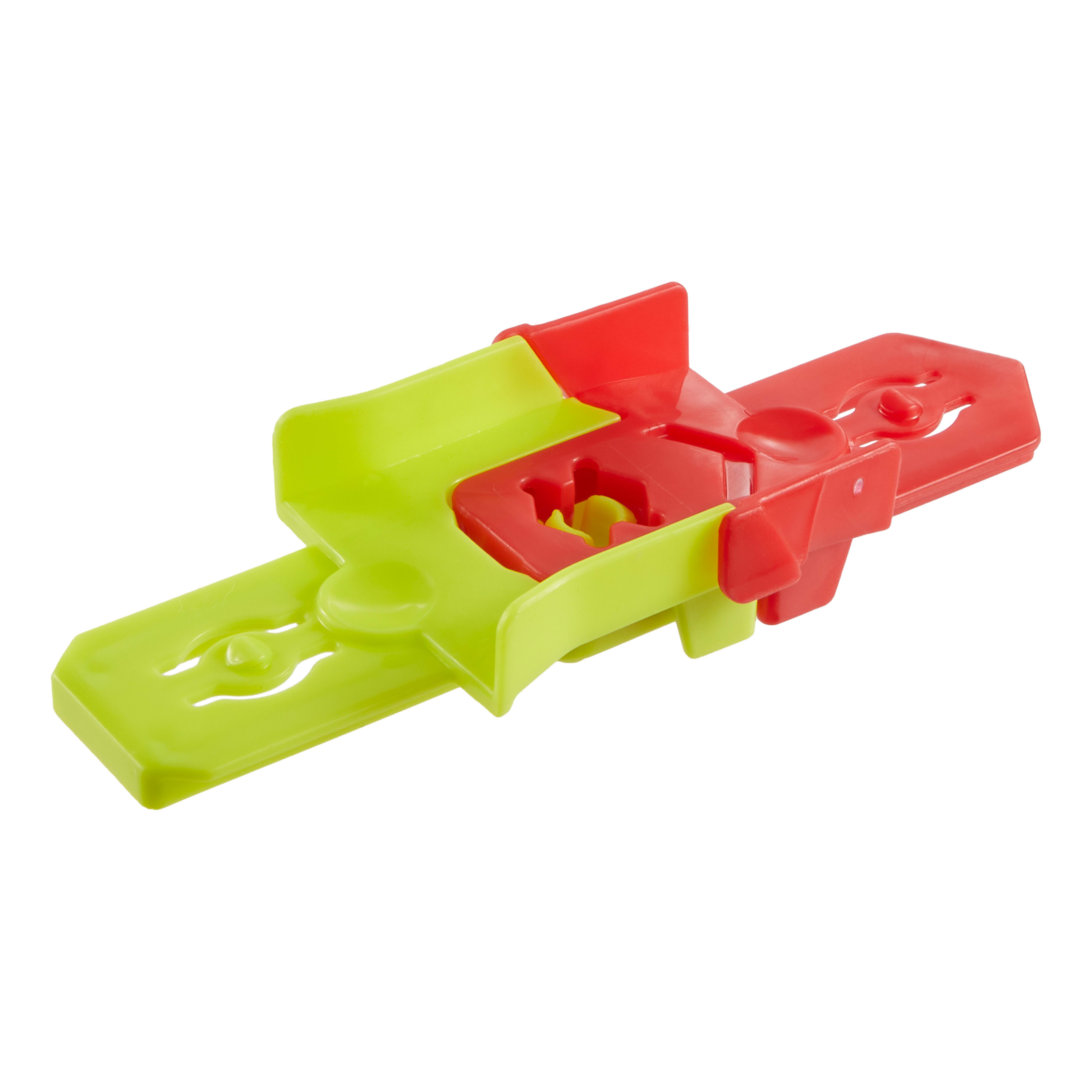 Plastikowe urządzenie w kolorach zielonym i czerwonym. Ma mechanizm przesuwny. Tło jest białe.