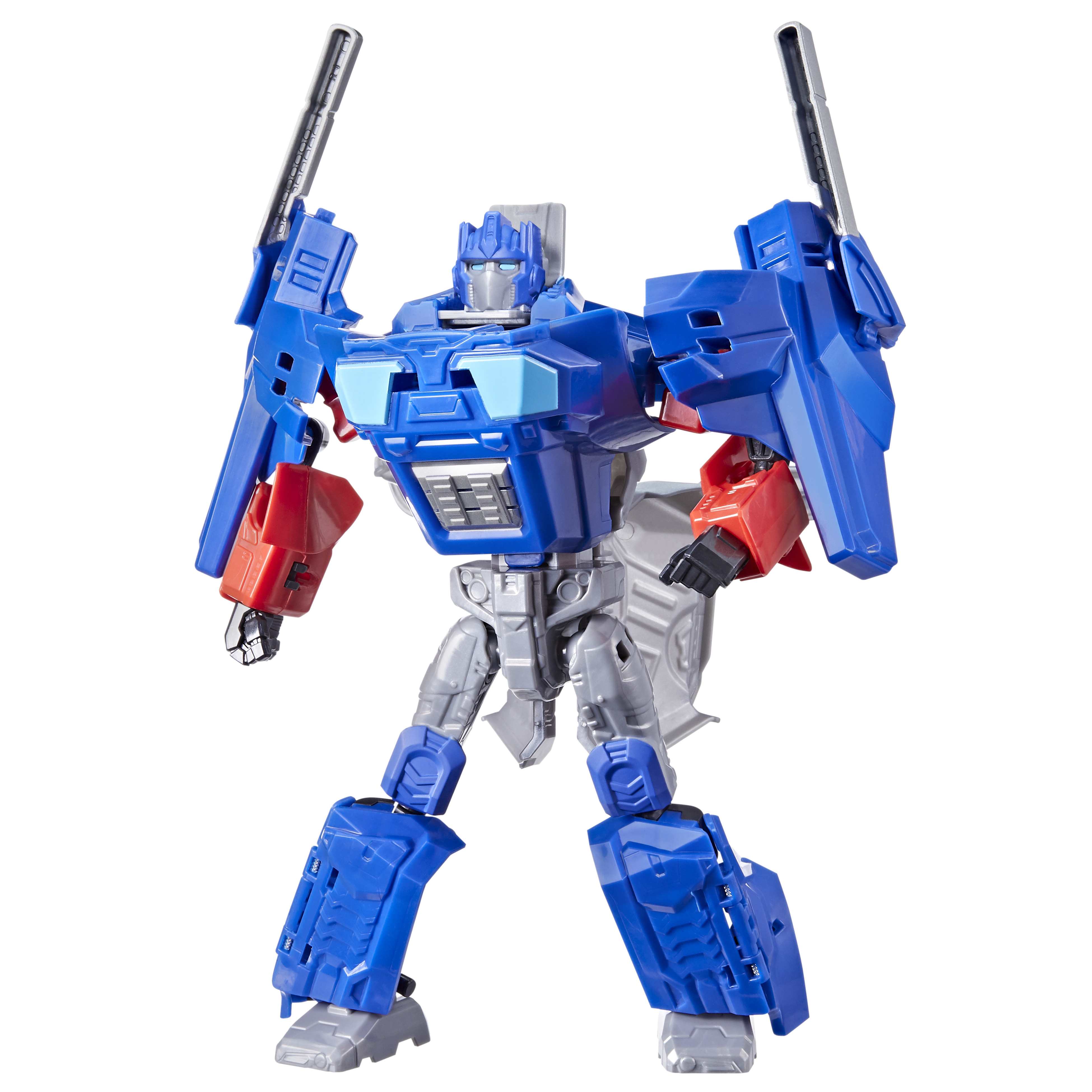 Un robot de juguete Transformer azul, rojo y plateado se alza sobre un fondo blanco, con los brazos levantados y dos cuchillas plateadas.