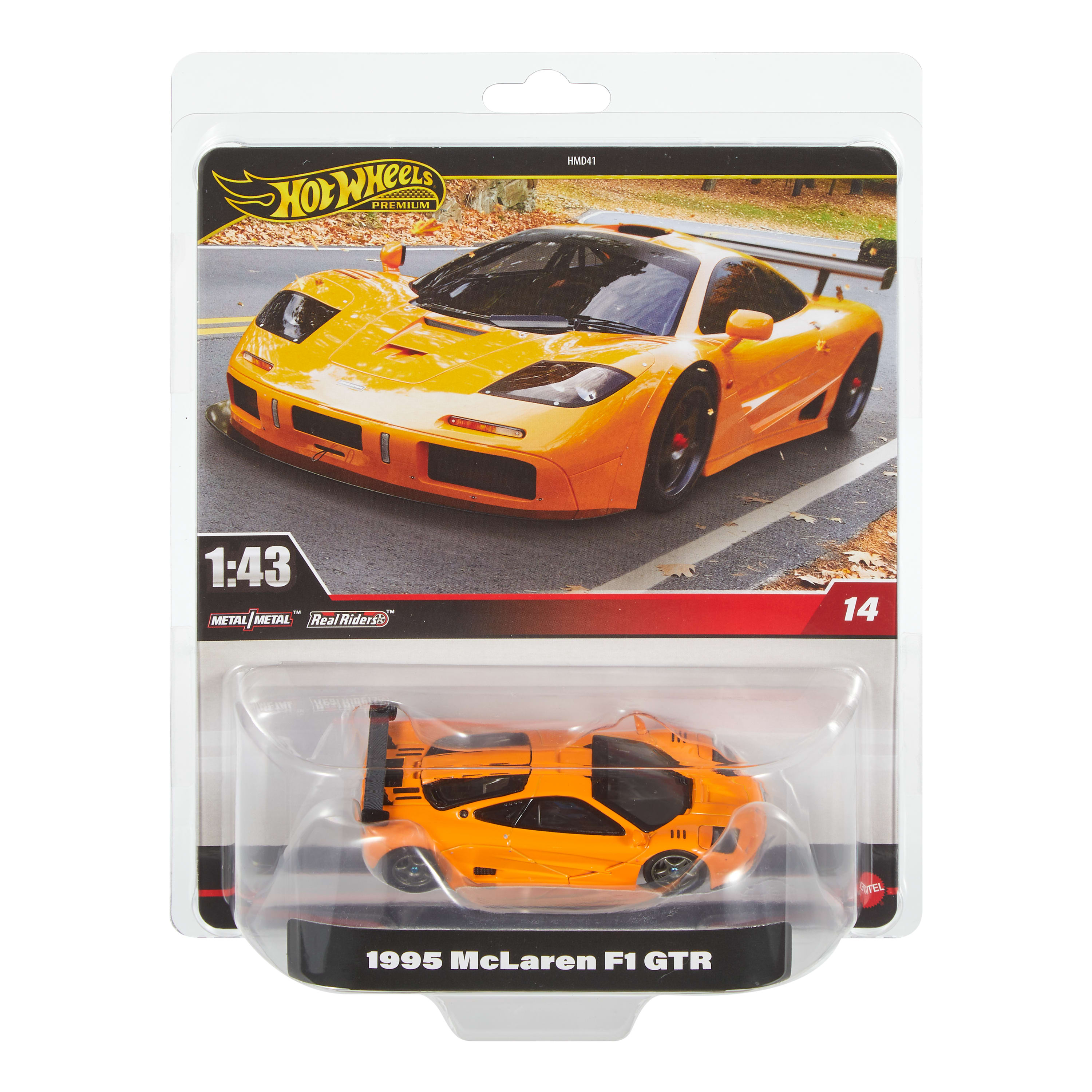 Ein orangefarbenes Hot-Wheels-Auto, ein McLaren F1 GTR von 1995, in einer transparenten Kunststoffverpackung.