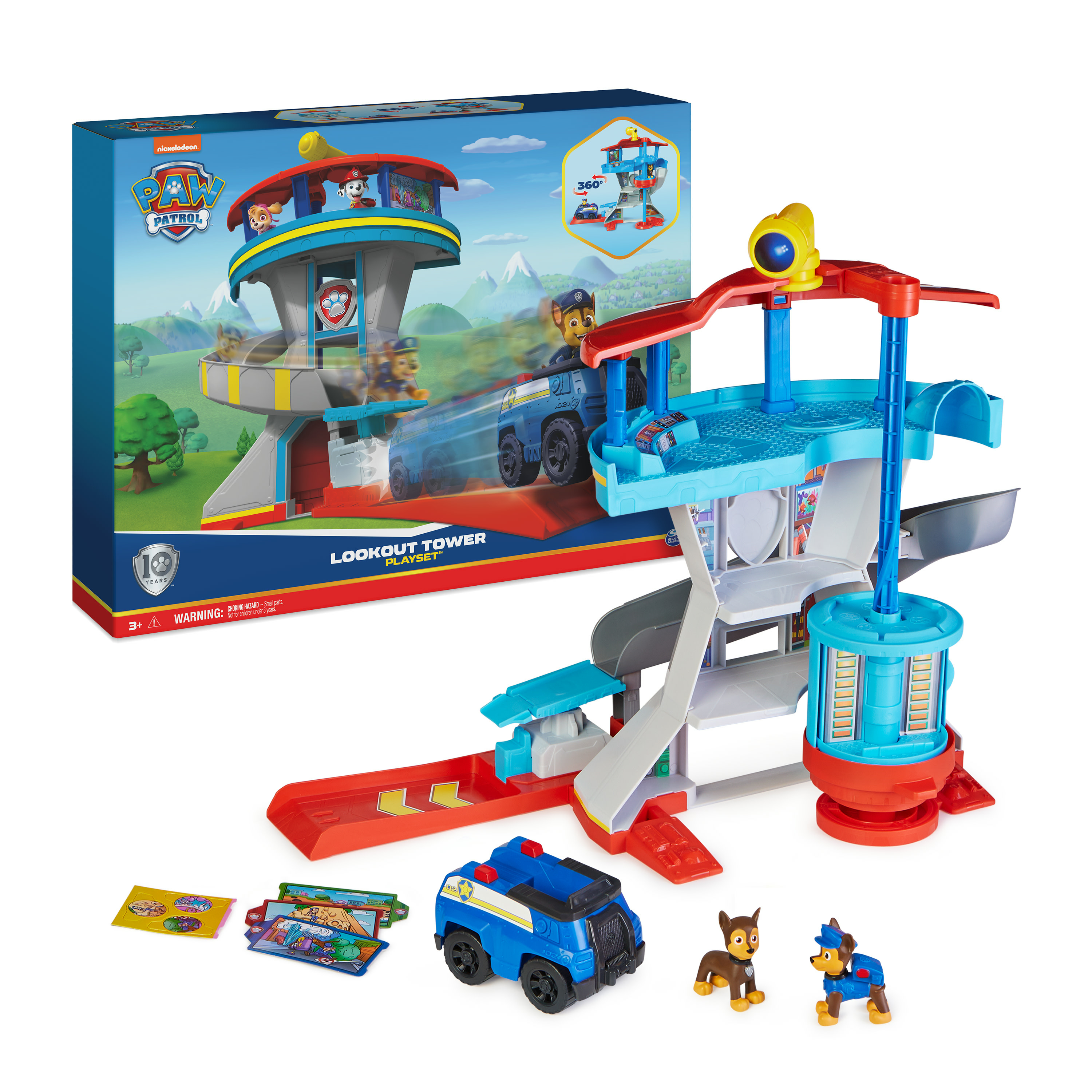 Un playset Paw Patrol Lookout Tower con torre, scivolo, auto e due statuette di cani.