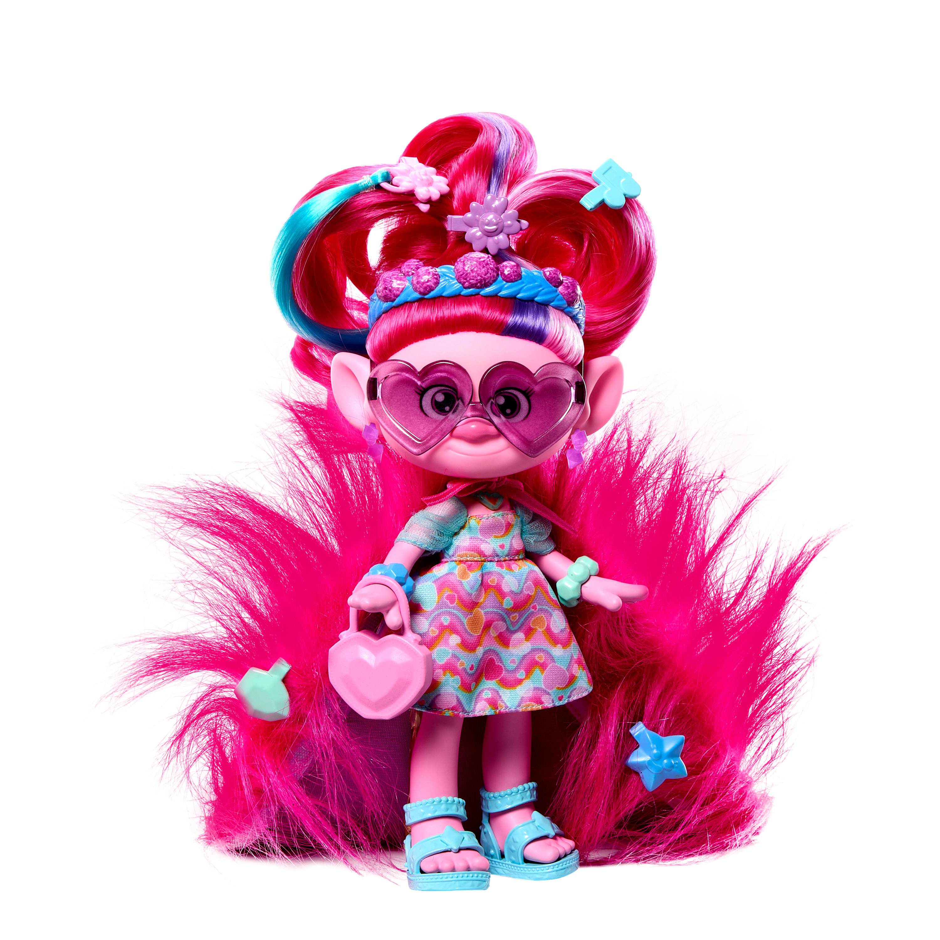 Eine bunte Troll-Puppe mit pinkem Haar, herzförmiger Brille und einem Kleid, umgeben von pinkfarbenem Flausch.