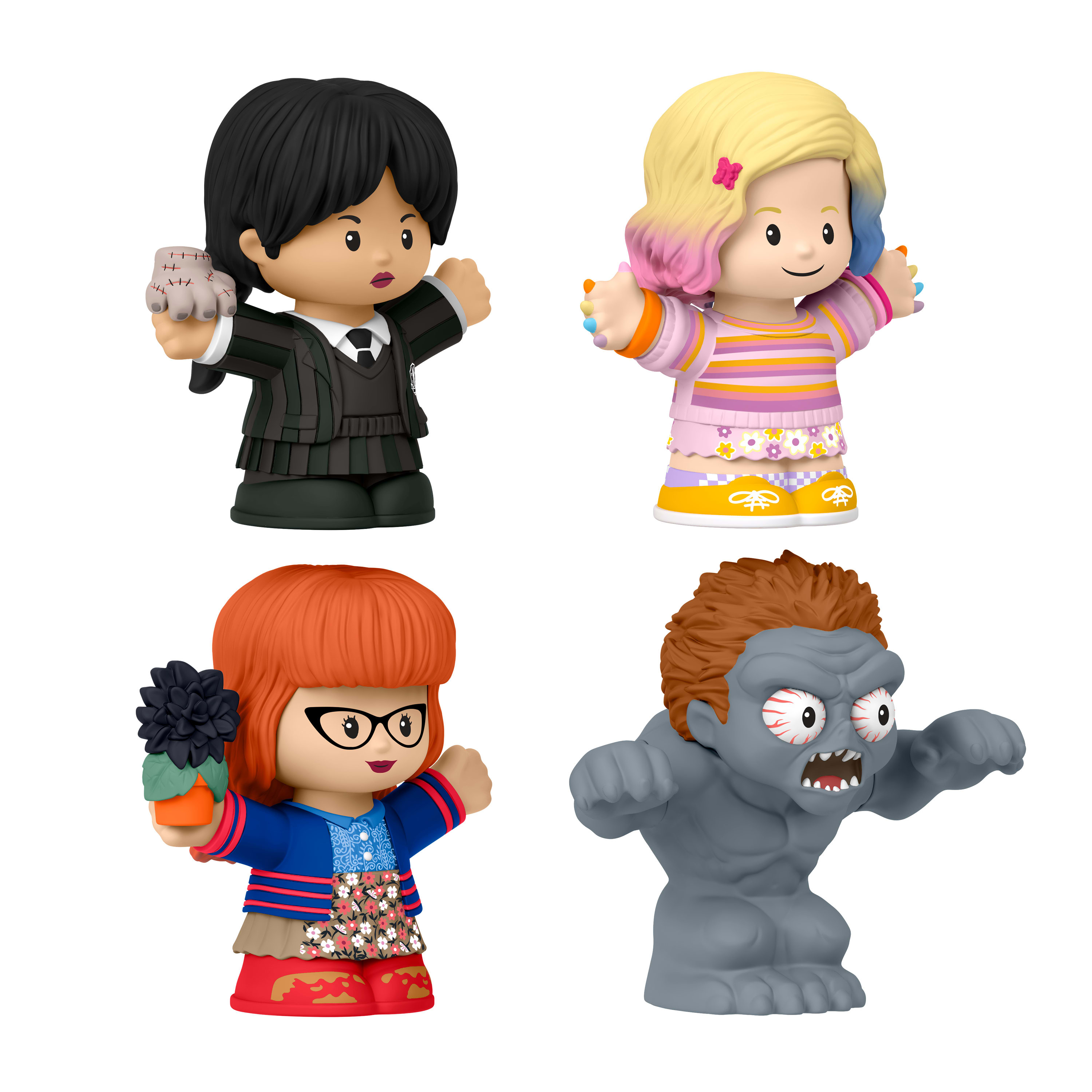 Vier bunte Little People Figuren. Sie sind Wednesday, Enid, Velma und eine zombieartige Figur. Alle auf weißem Hintergrund.