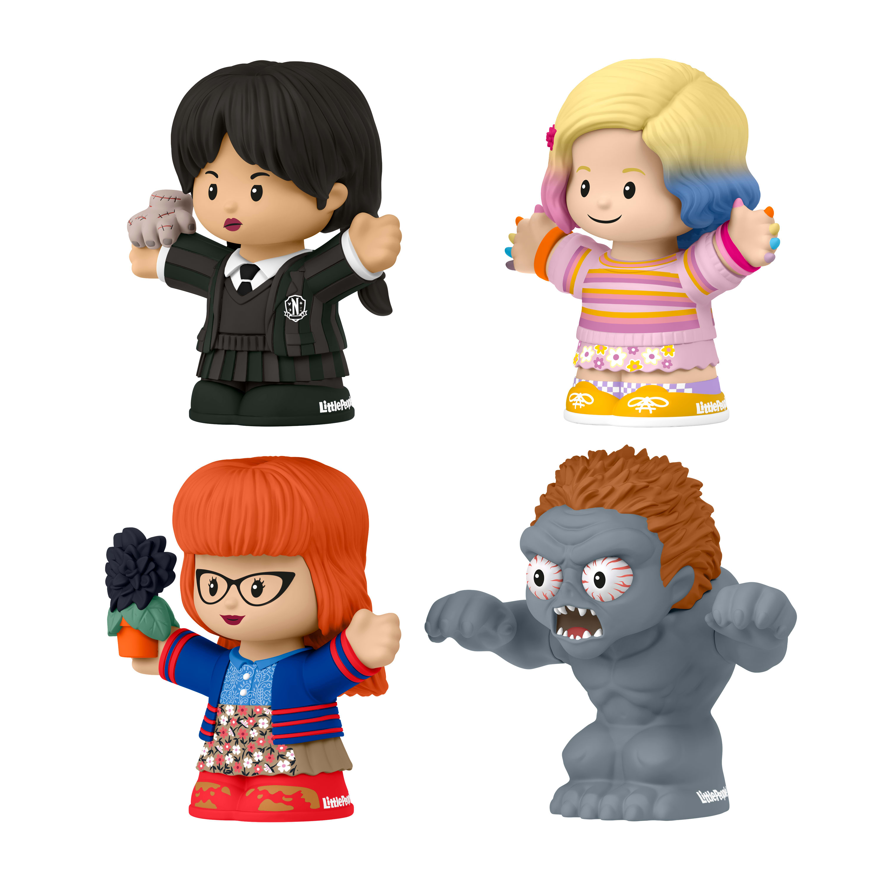 Vier Little People Figuren: Wednesday Addams, Enid Sinclair, eine Frau mit Brille und ein graues Monster.